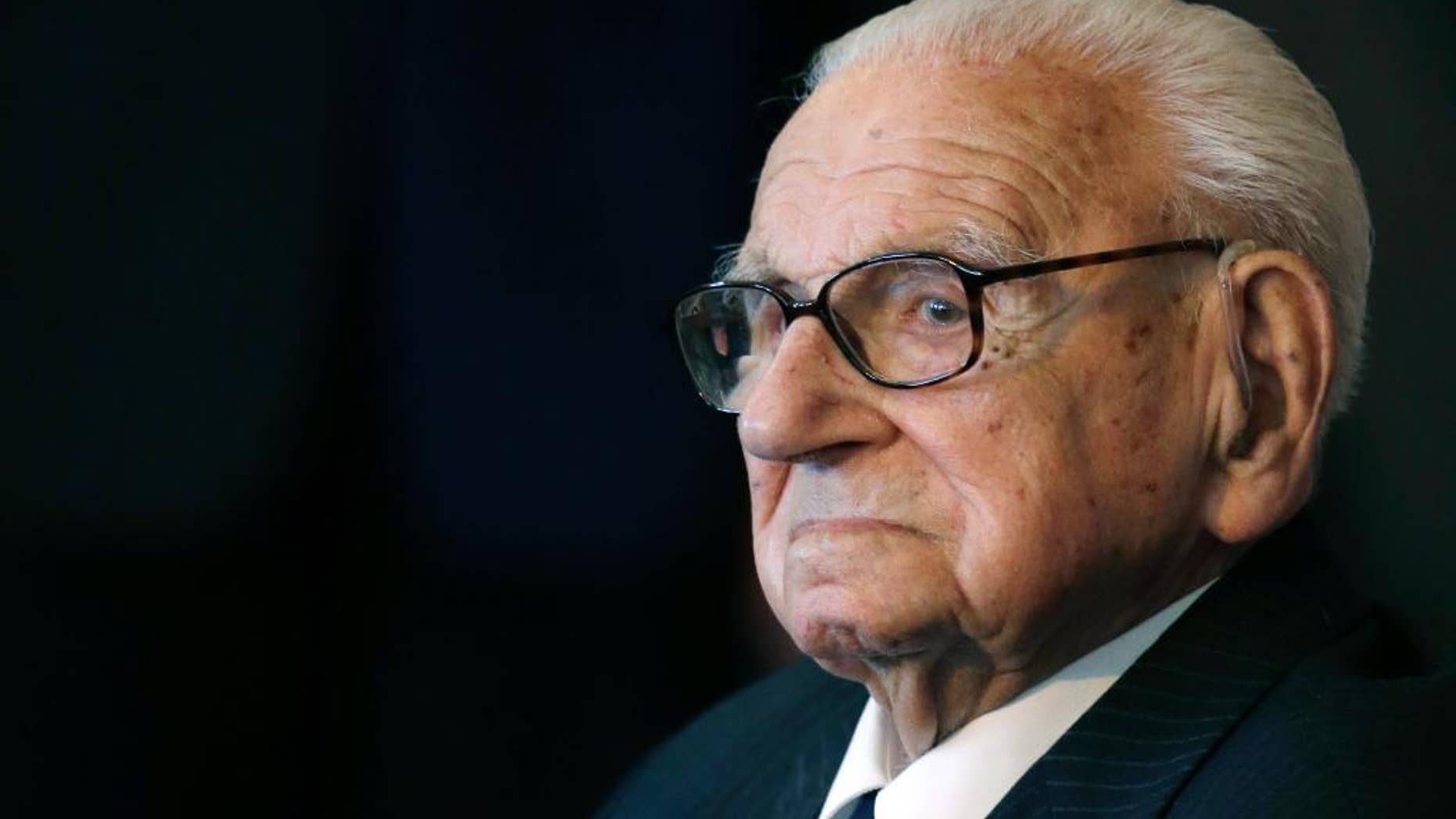 105 year-old sir Nicholas Winton waits to be decorated with the highest Czech Republic's decoration, The Order of the White Lion at the Prague Castle in Prague, Czech Republic, Tuesday, Oct. 28, 2014. Sir Winton saved 669 Jewish children from Nazi annihilation by transporting them out of Prague to Great Britain in 1939. (AP Photo/Petr David Josek)