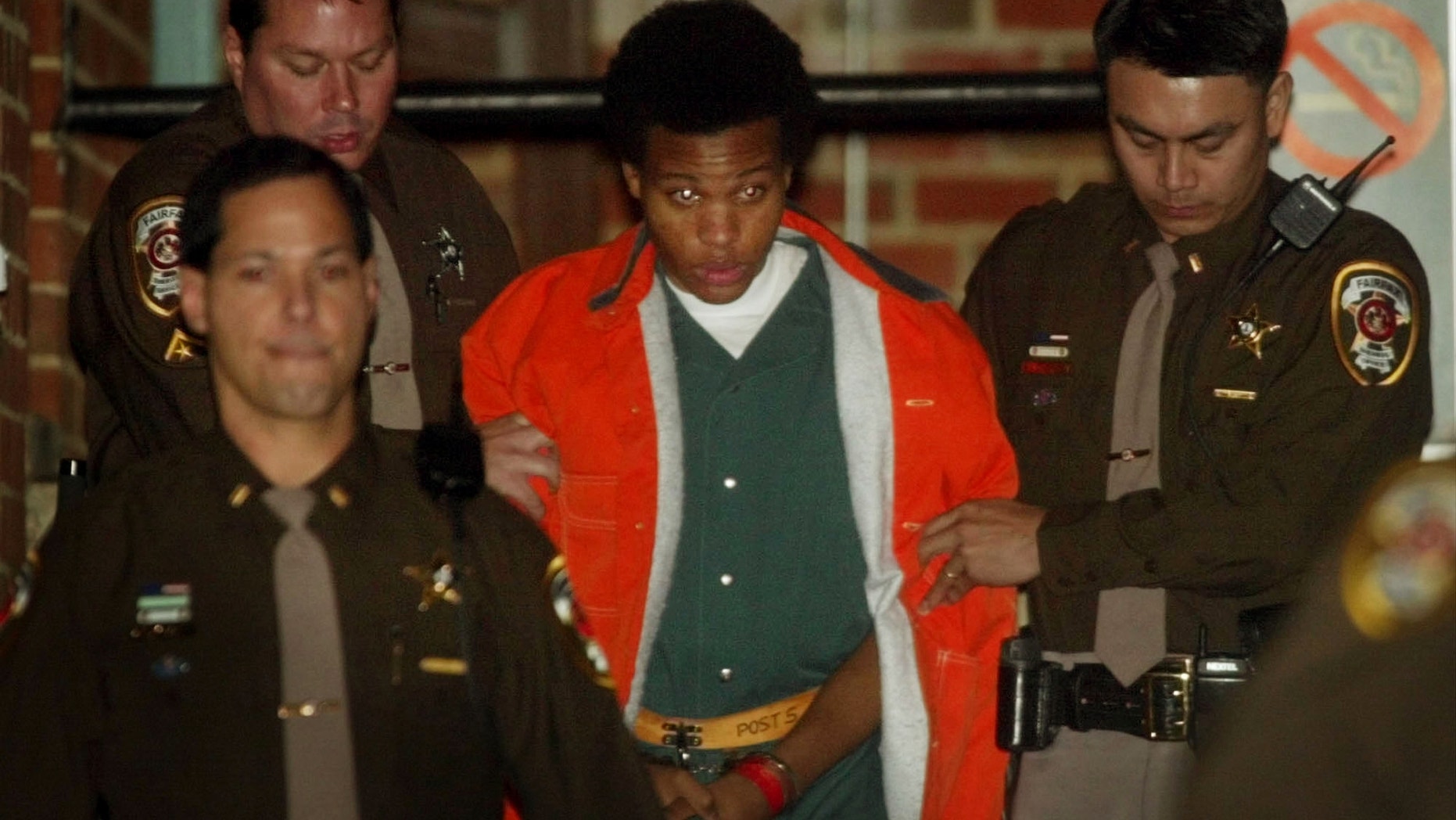 FILE: Lee Boyd Malvo is escorted from court after his preliminary hearing in Fairfax, Va.