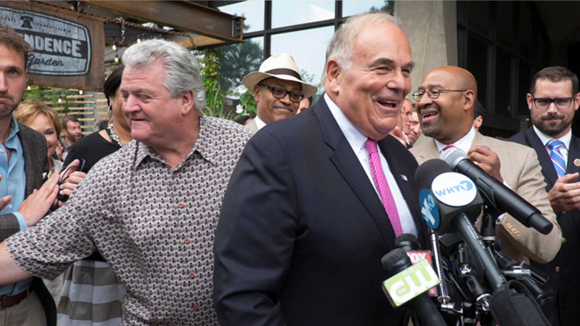 In this Thursday, Aug. 7, 2014 photo, U.S. Rep. Bob Brady, left, former Pennsylvania Gov. Ed Rendell, standing by the microphones, and Philadelphia Mayor Michael Nutter, second from right, appear at the Independence Beer Garden to kick off Philadelphia's final push for a winning bid to secure the 2016 Democratic Convention, in Philadelphia. (AP Photo/The Philadelphia Inquirer, Ed Hille) MAGS OUT; NEWARK OUT