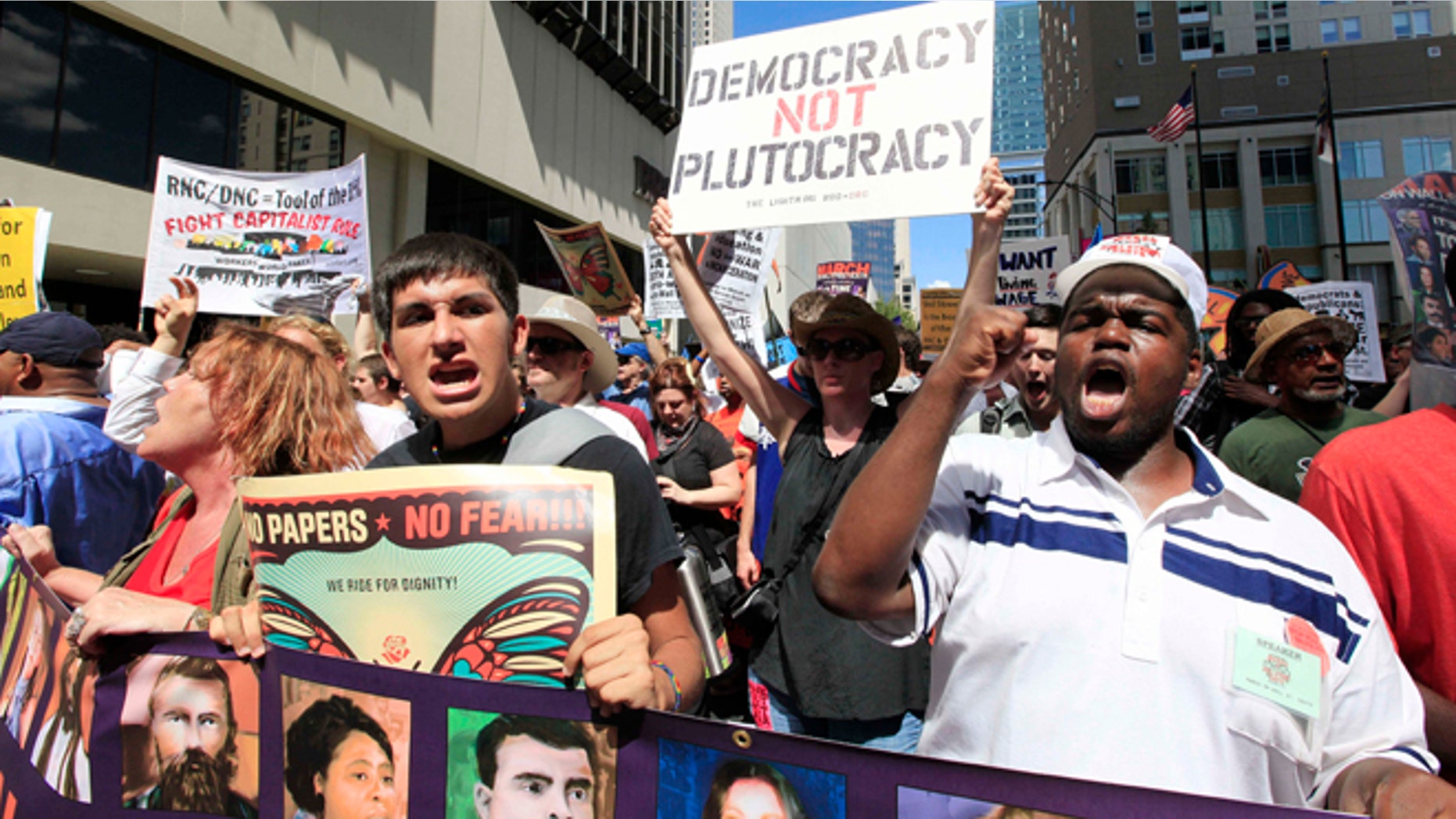 Demonstrators walk during a protest march, Sunday, Sept. 2, 2012, in Charlotte, N.C. Demonstrators are protesting before the start of the Democratic National Convention. (AP Photo/Chuck Burton)