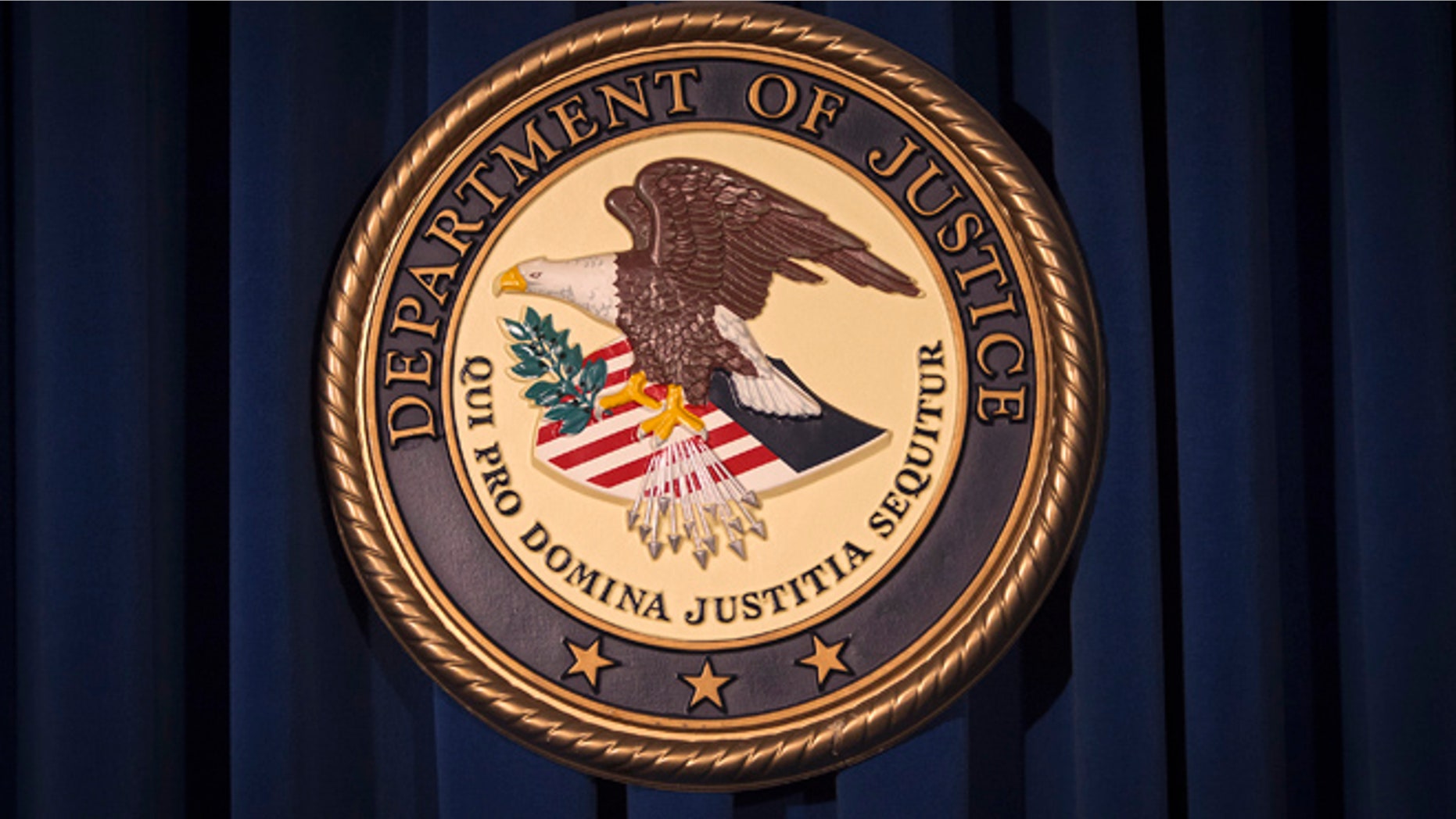 The Department of Justice (DOJ) logo is pictured.