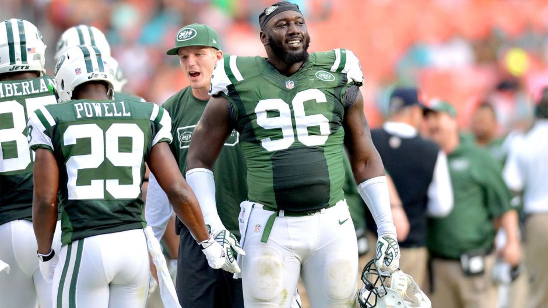 Dec 28, 2014; Miami Gardens, FL, USA; New York Jets defensive end Muhammad Wilkerson (96) laughs on the sideline during the second half against the Miami Dolphins at Sun Life Stadium. Mandatory Credit: Steve Mitchell-USA TODAY Sports