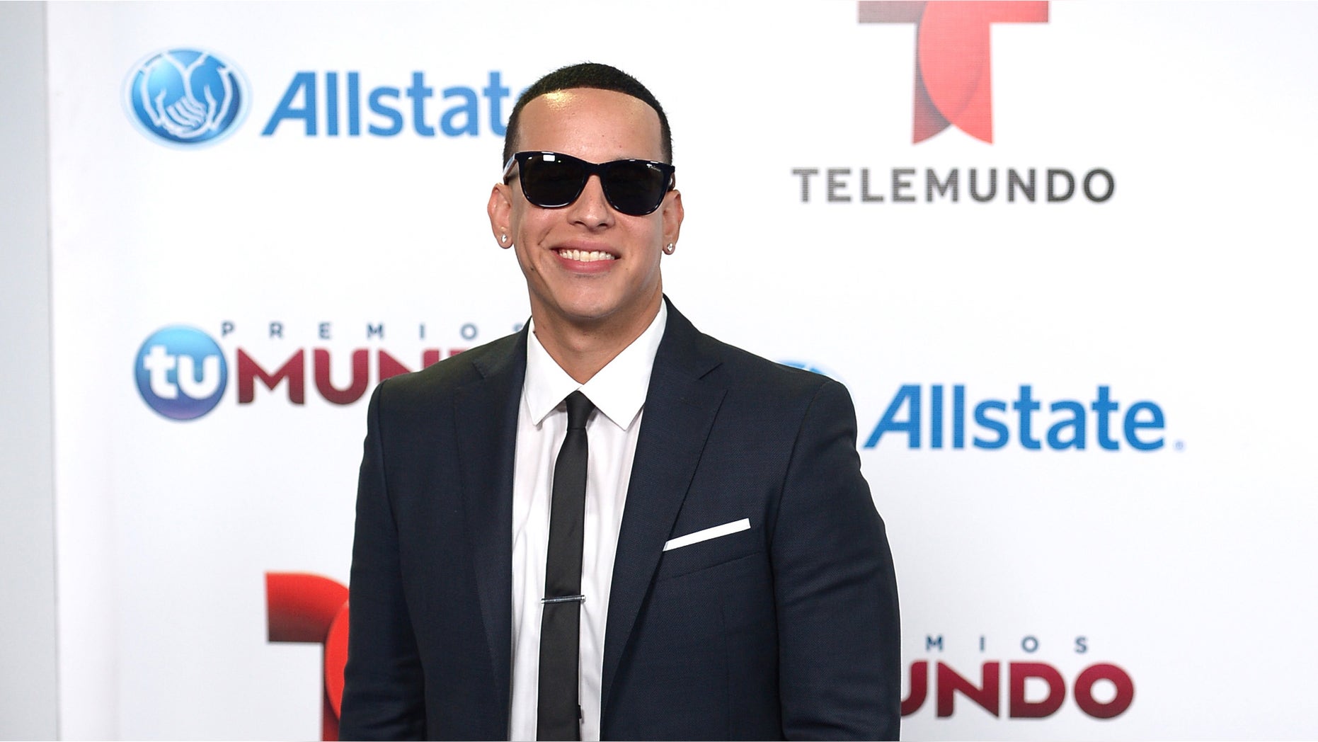 Daddy Yankee arrives for Telemundo's Premios Tu Mundo Awards at American Airlines Arena on August 15, 2013 in Miami, Florida.