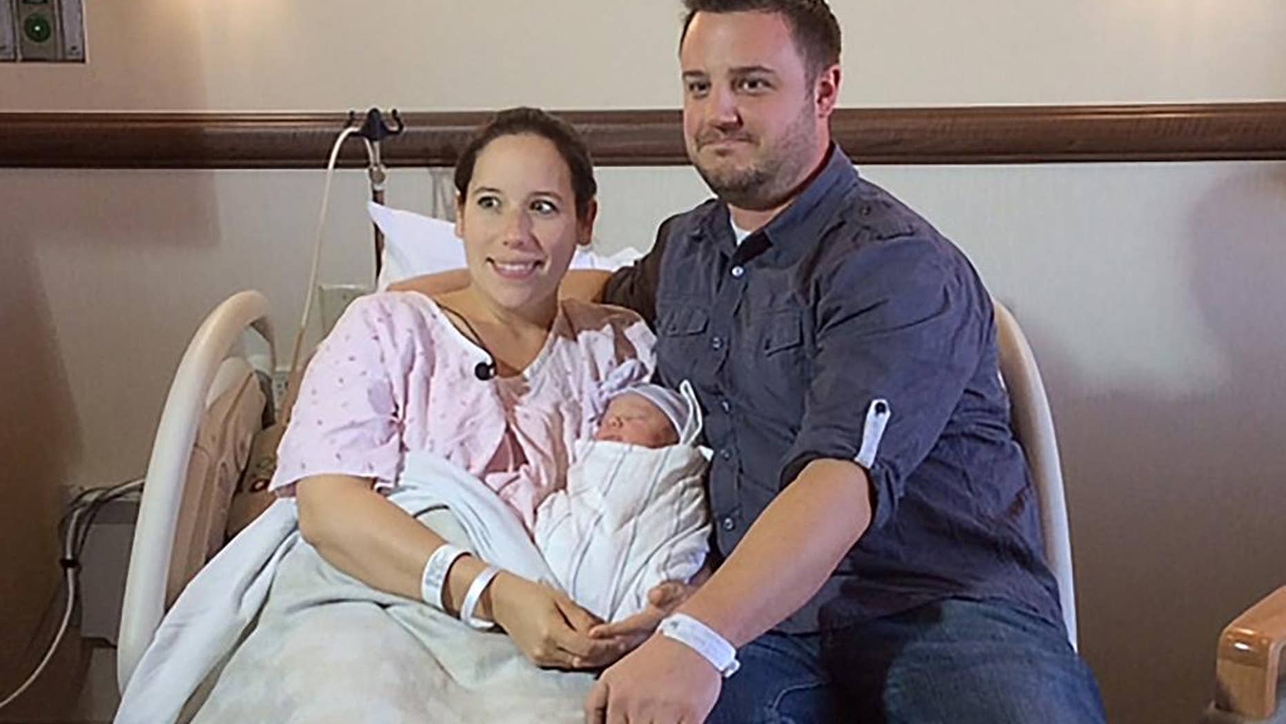 Katherine and Keith Arthur poses with their baby girl, Colette at the hospital Wednesday, Mar. 5, 2014. With help from a 911 dispatcher, the couple delivered their baby girl, Colette, on Wednesday morning in the bathtub of their home in Laguna Nigel, Calif., The dispatcher, Brodie Lefebvre, a father of eight, talked him through the delivery. Lefebvre is the nephew of Jim Lefebvre, who was 1965 National League rookie of the year with the Dodgers.(AP Photo/Orange County Fire Authority,Steve Concialdi)