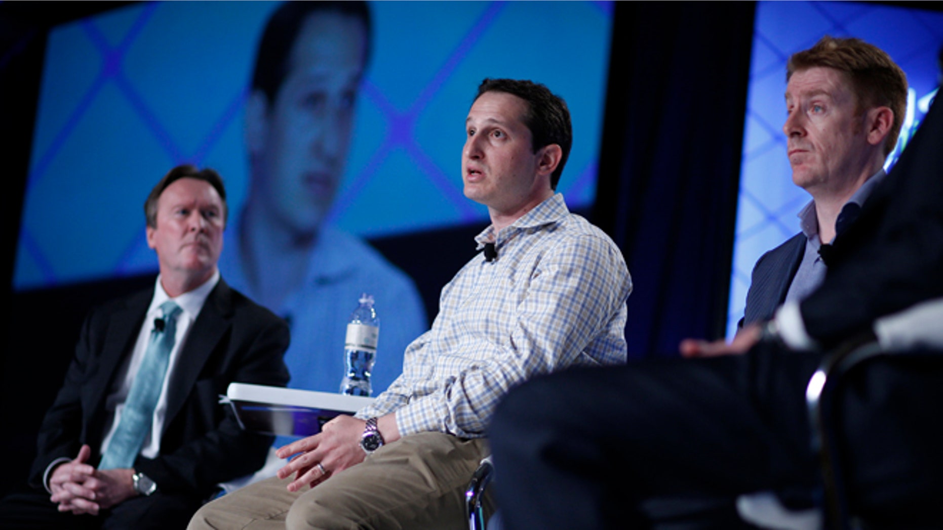 Sept. 29, 2015: Jason Robins, center, CEO of DraftKings website, speaks on a panel at the Global Gaming Expo in Las Vegas.