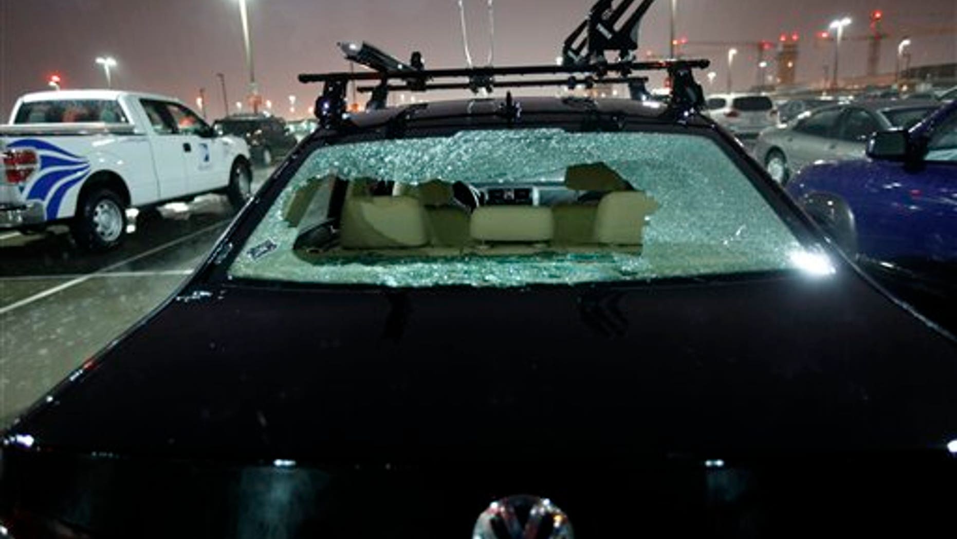 May 24: The rear windshield of a parked car at Love Field Airport in Dallas was shattered by hail during severe weather that also produced a tornado nearby.