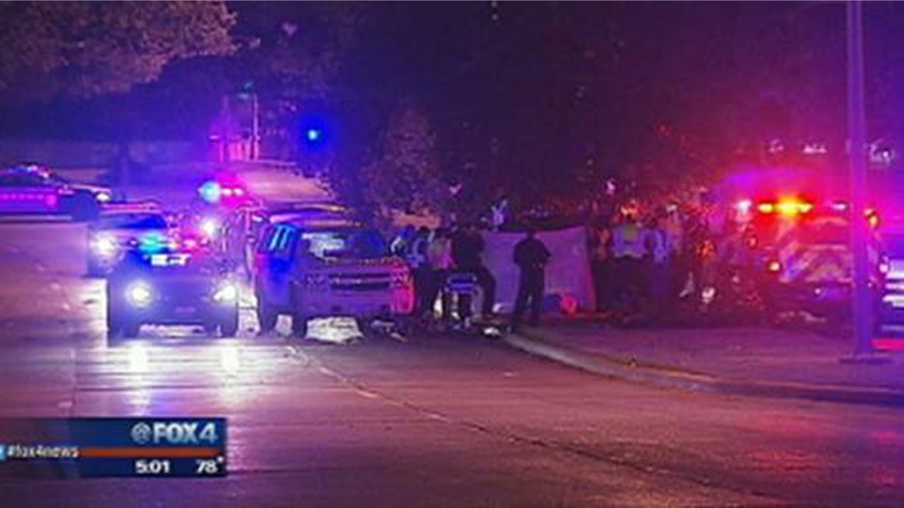 August 31, 2014: Police gather at the site of a car crash that killed six people, including three teenagers, in the Oak Cliff section of Dallas, Texas. (MyFoxDFW.com)