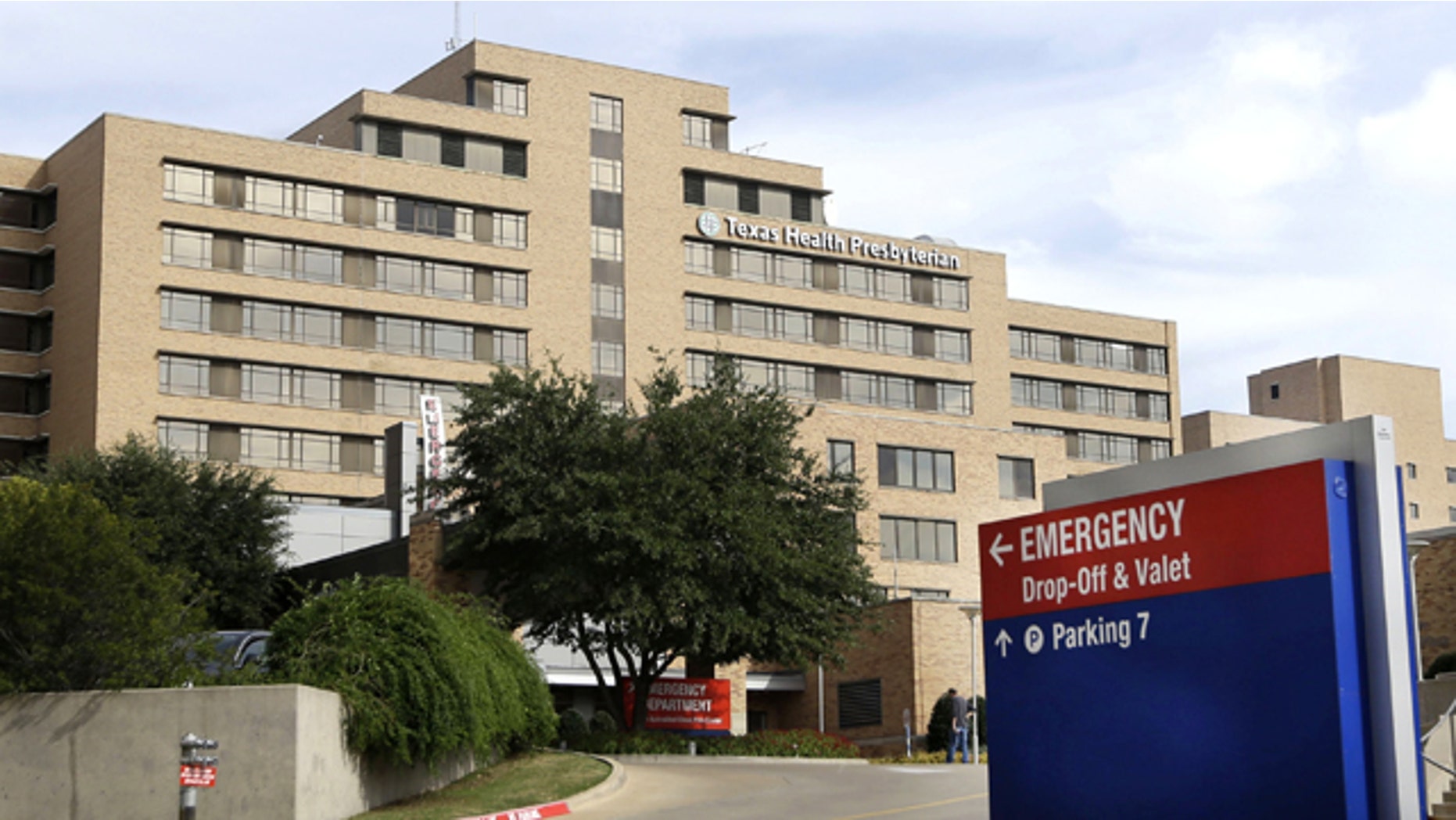 FILE - In this Oct. 8, 2014 file photo, a sign points to the entrance to the emergency room at Texas Health Presbyterian Hospital Dallas, where U.S. Ebola patient Thomas Eric Duncan was treated. (AP Photo/LM Otero, File)