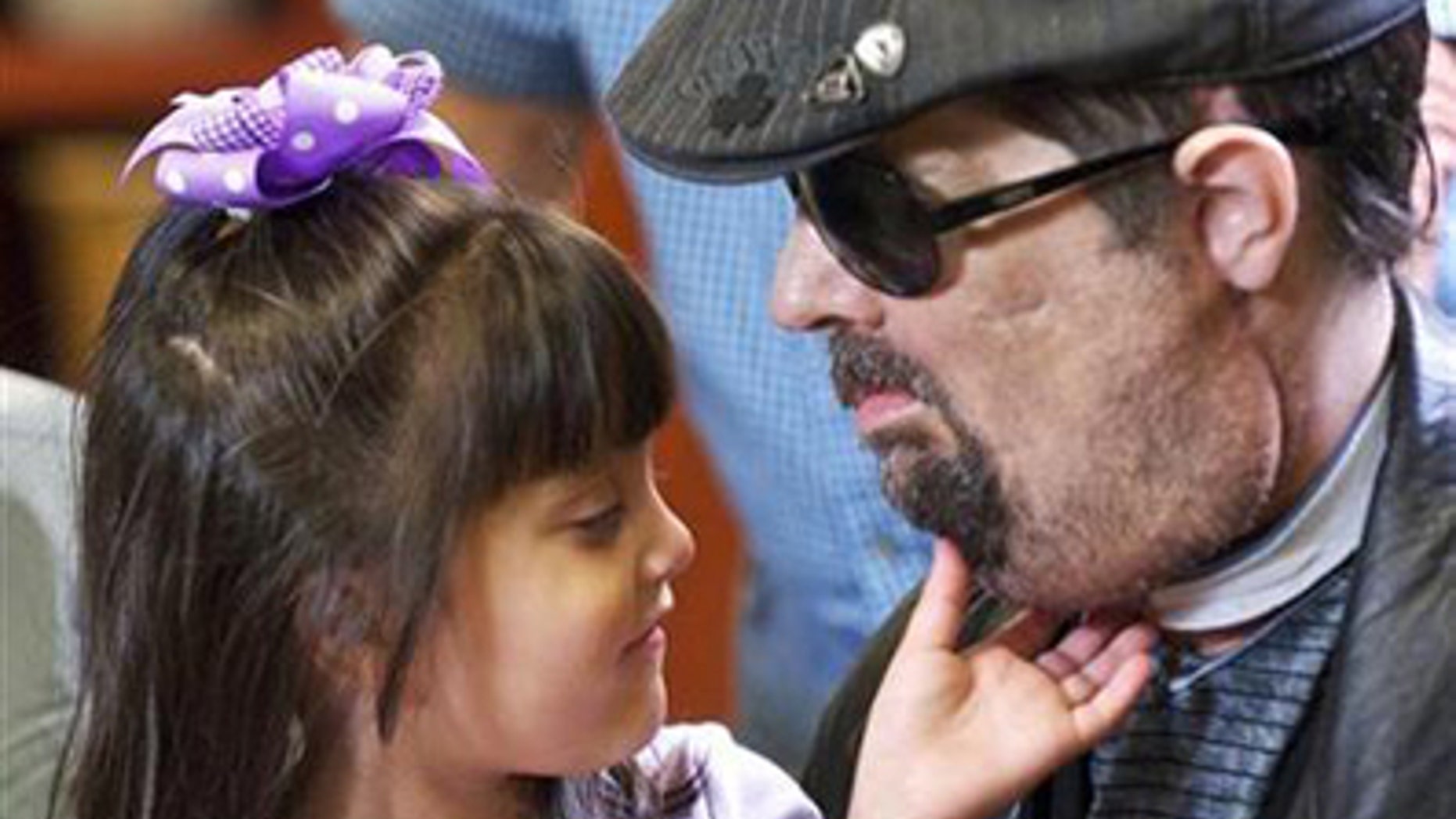 Full face transplant patient Dallas Wiens is seen with his 4-year old daughter Scarlette in this undated handout image.