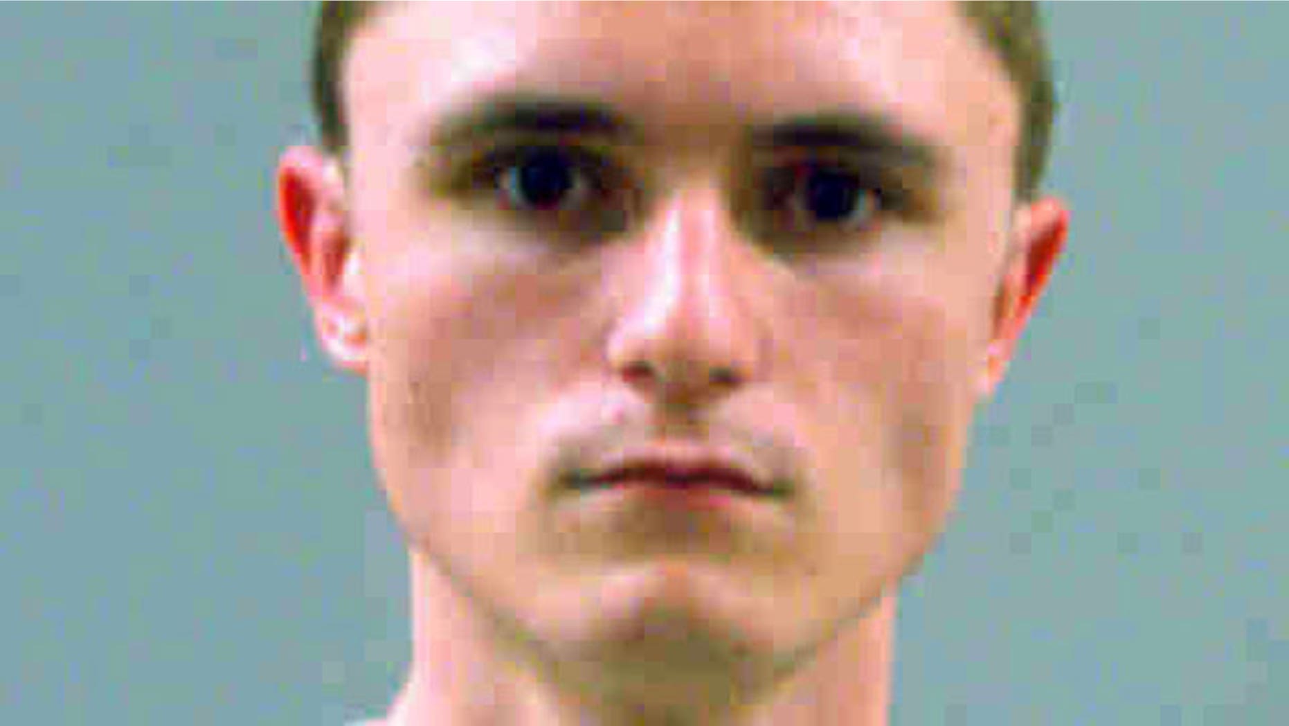 Dallin Morgan, 18, seen in this booking photo, was arrested with a fellow high school student on conspiracy charges after authorities uncovered a plot to use explosives during a school assembly.
