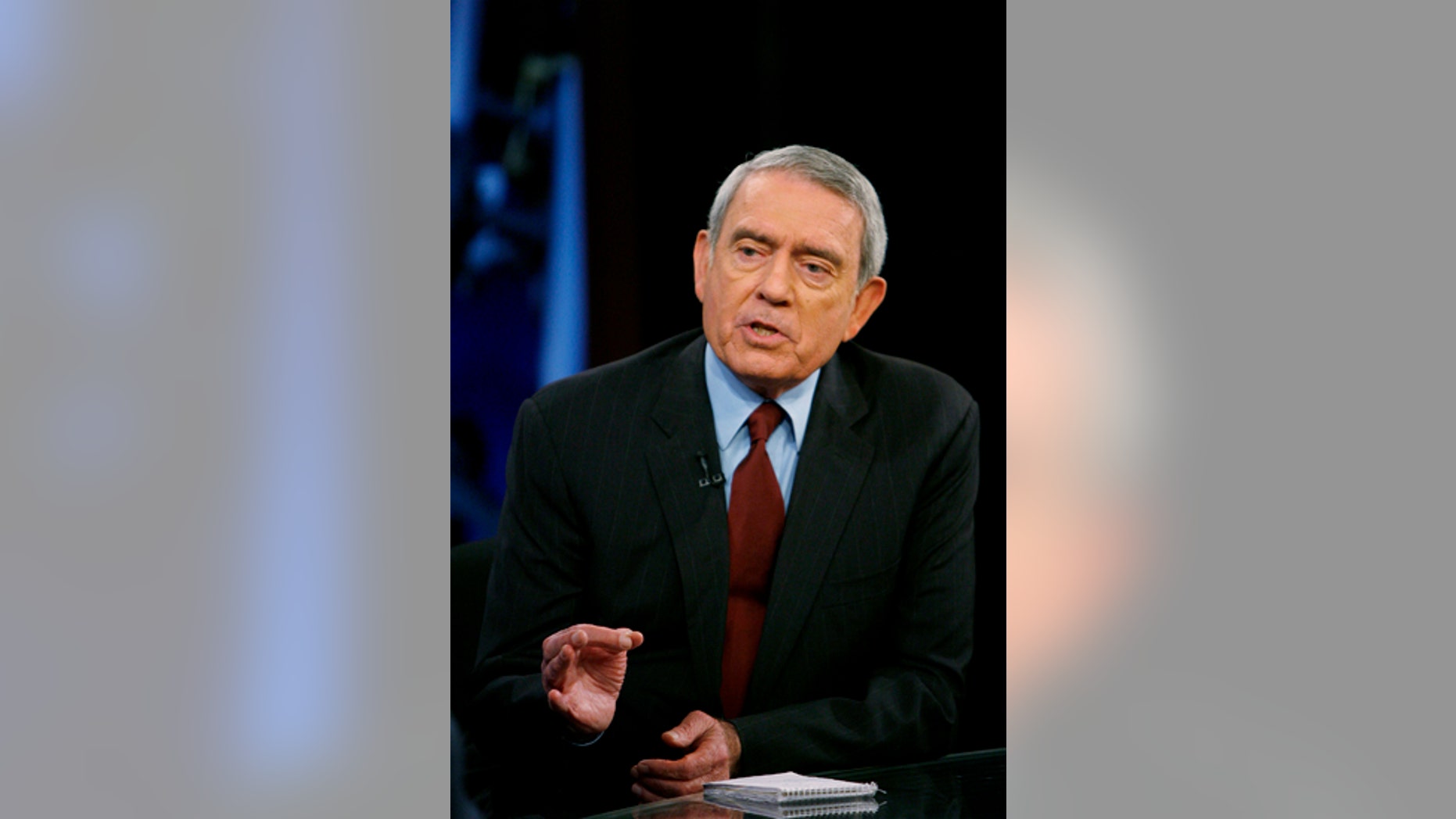 Television journalist Dan Rather addresses his views on the state of television news on the FOX News Channel show "Your World" with David Asman in New York June 12, 2007. REUTERS/Lucas Jackson (UNITED STATES)