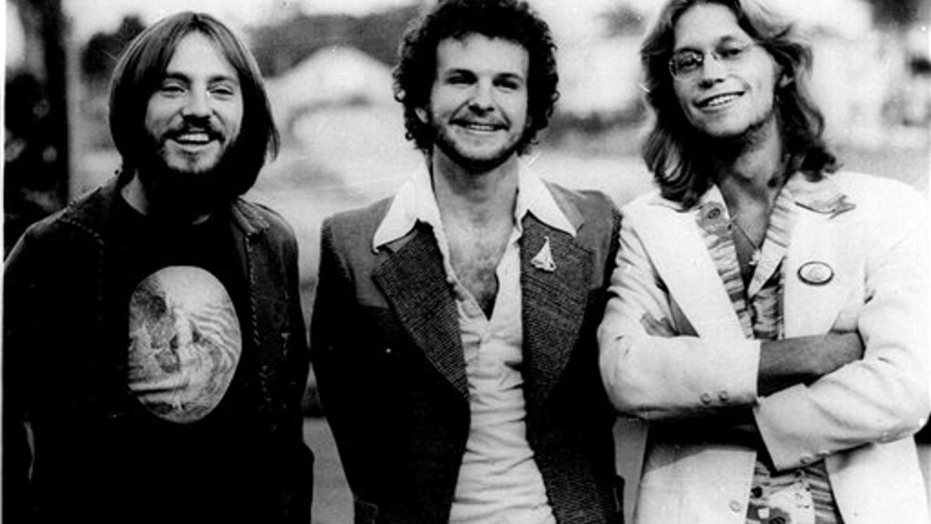 The rock group "America" is shown in this photo dated 1976. Members of the group, shown from left are: Dewey Bunnel, Dan Peek, and Gerry Beckley. Peek, a founding member of the popular 1970s band America and singer of high harmonies on hits that included "A Horse With No Name" and "Ventura Highway," died Sunday in bed in his home in Farmington, Mo., his father said Tuesday, July 26, 2011. (AP)