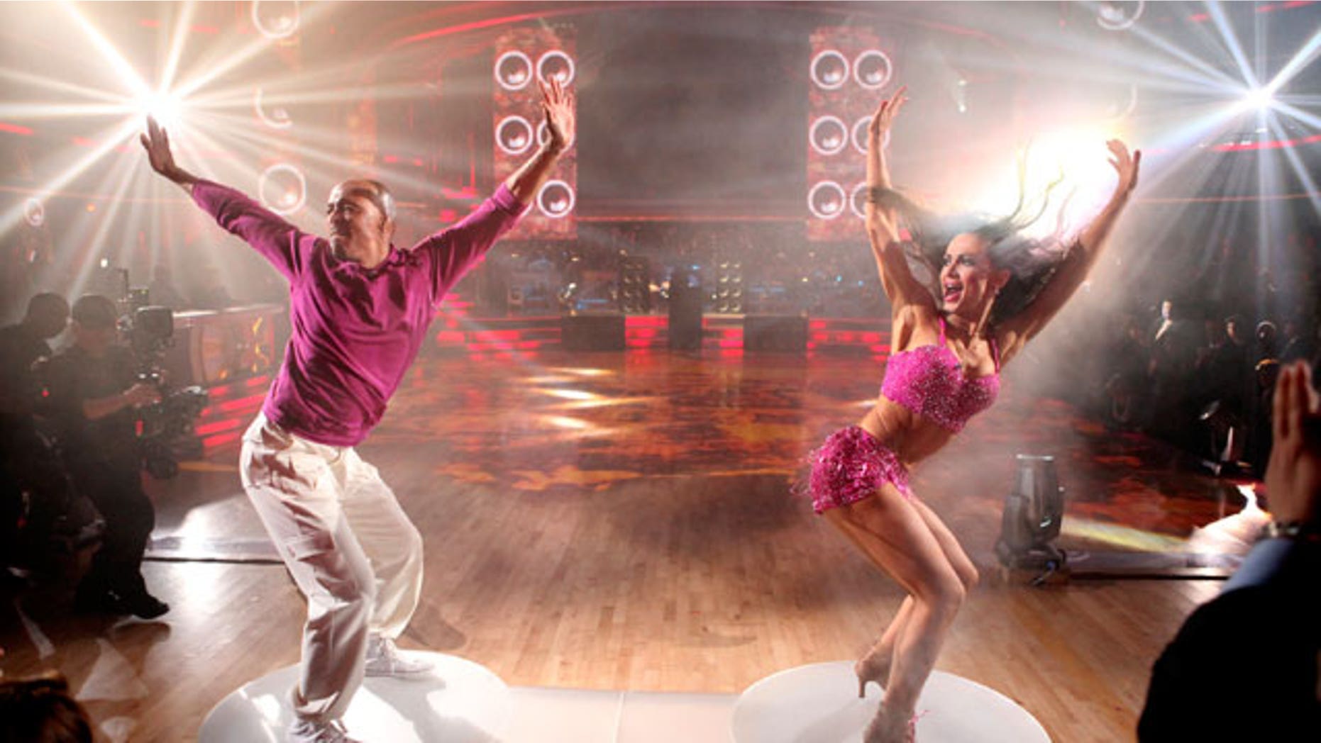 In this Nov. 21, 2011 file photo released by ABC, J.R. Martinez, left, and his partner Karina Smirnoff perform on the celebrity dance competition series "Dancing with the Stars," in Los Angeles.