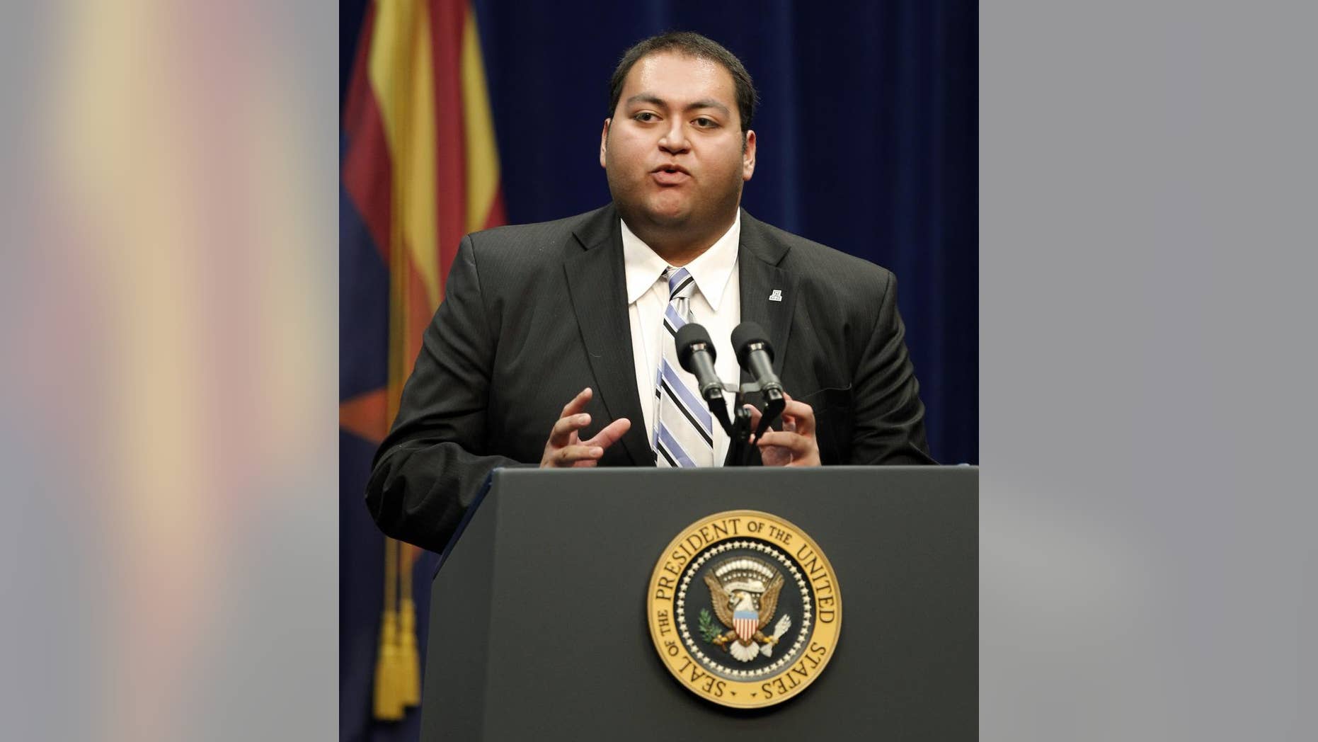 Daniel Hernandez, a intern for Rep. Gabrielle Giffords, speaks at a memorial service for the victims of Saturday's shootings at McKale Center on the University of Arizona campus Wednesday, Jan. 12, 2011, in Tucson, Ariz. (AP Photo/Chris Carlson)