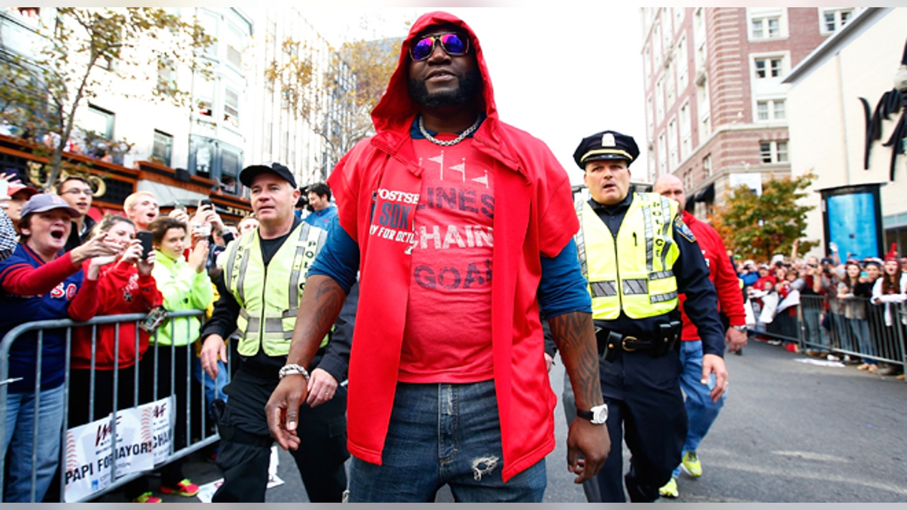 BOSTON, MA - NOVEMBER 02: David Ortiz #34 of the Boston Red Sox walks down Boylston Street near the finish line of the Boston Marathon during the World Series victory parade on November 2, 2013 in Boston, Massachusetts. (Photo by Jared Wickerham/Getty Images)