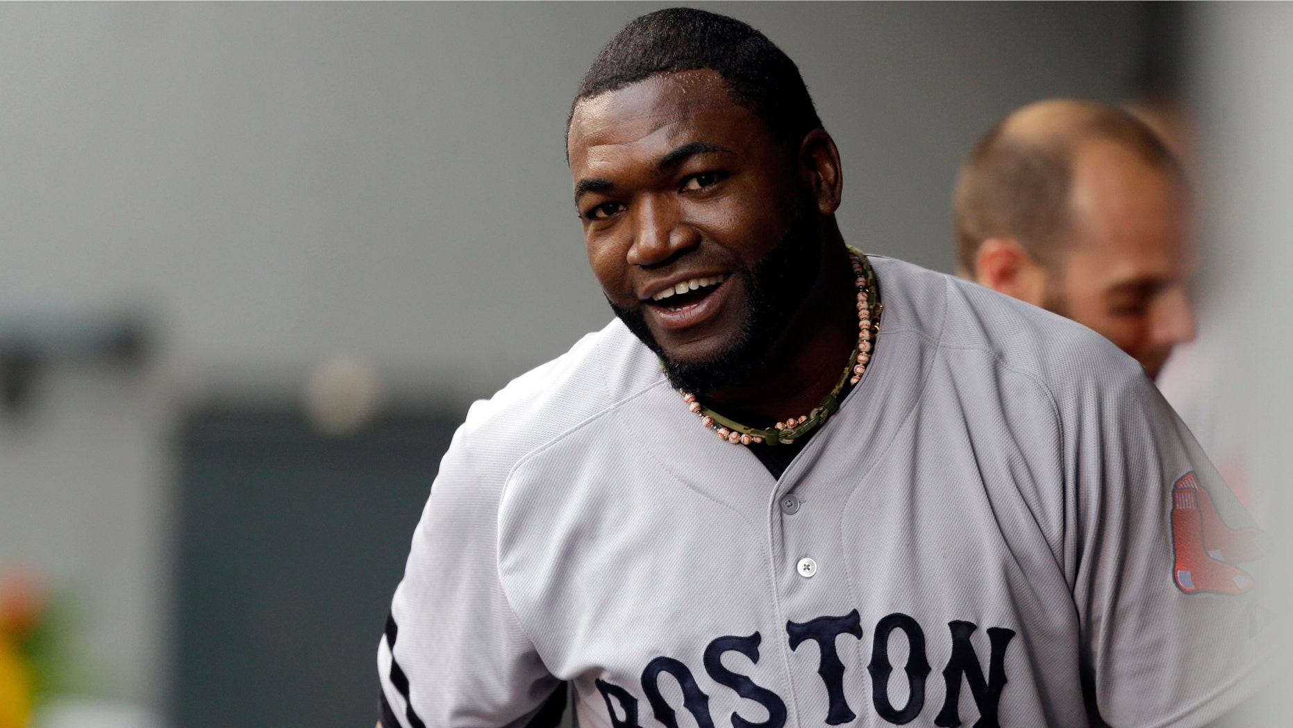 Boston Red Sox's David Ortiz reacts in the dugout after he scored a run in the second inning after hitting a double against the Seattle Mariners, Wednesday, July 10, 2013, in Seattle. With the hit, Ortiz' 1689th in his MLB career, he passed the record held by Harold Baines for the most hits as a designated hitter in major league history. (AP Photo/Ted S. Warren)
