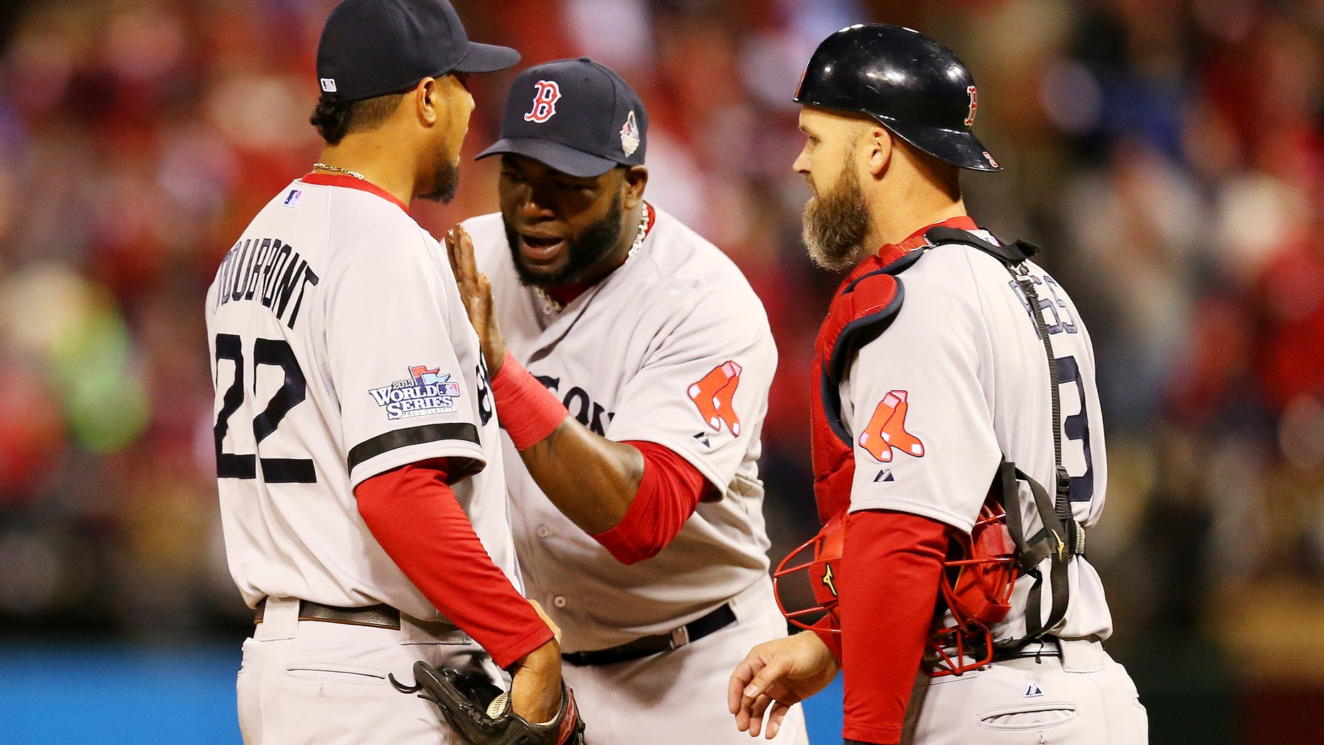 ST LOUIS, MO - OCTOBER 27: David Ortiz #34 and David Ross #3 of the Boston Red Sox talk with pitcher Felix Doubront #22 against the St. Louis Cardinals during Game Four of the 2013 World Series at Busch Stadium on October 27, 2013 in St Louis, Missouri. (Photo by Ronald Martinez/Getty Images)