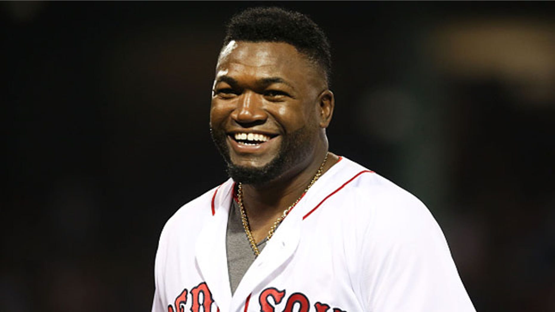 David Ortiz #34 of the Boston Red Sox smiles in the fifth inning during the game against the Texas Rangers at Fenway Park on July 6, 2016 in Boston, Massachusetts.
