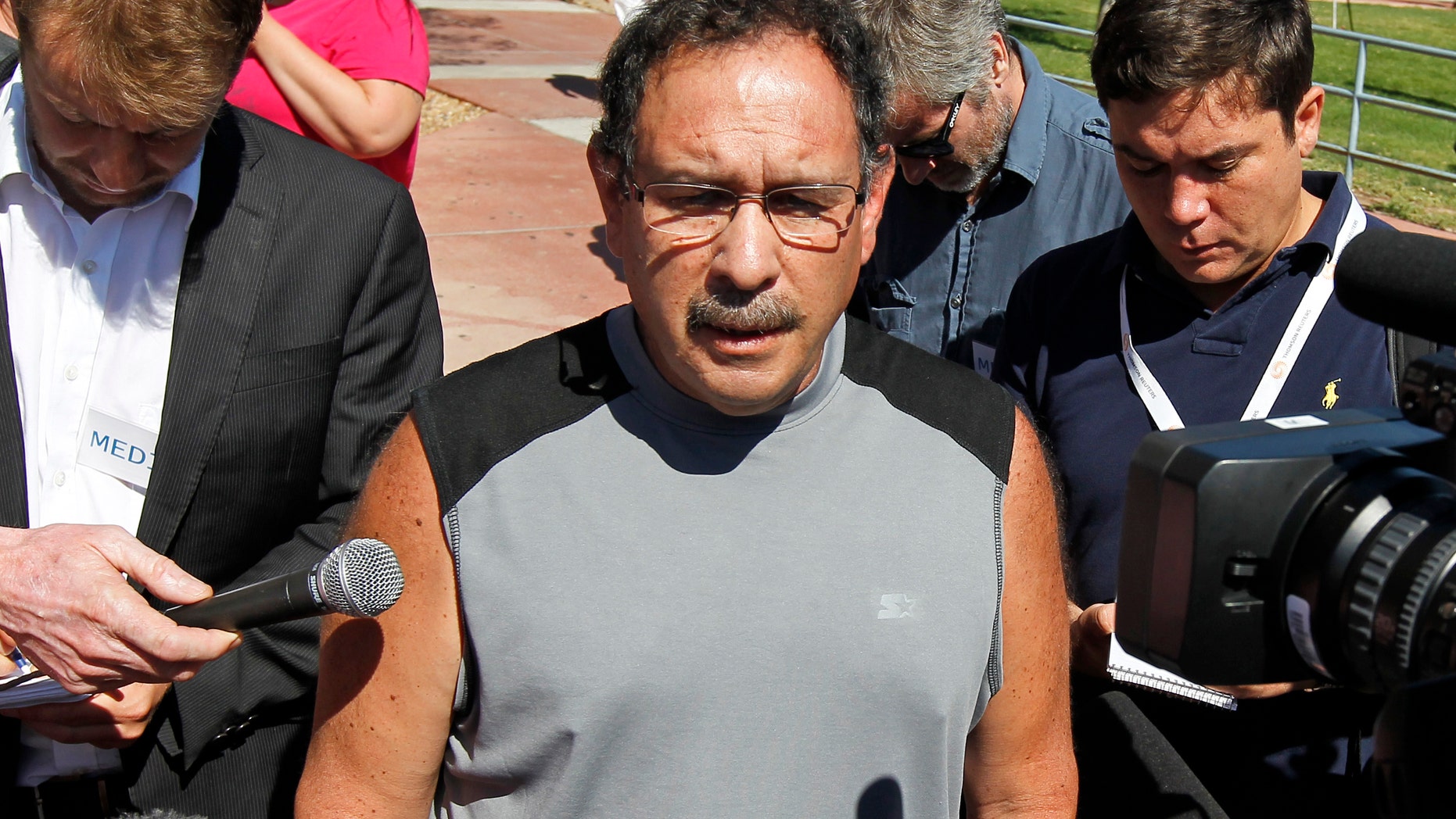 David Sanchez, whose son-in-law was critically wounded, speaks after a court appearance by shooting suspect James Holmes at the Arapahoe County Courthouse, Monday, July 23, 2012, in Centennial, Colo. Twelve people were killed and dozens were injured in the shooting attack early Friday at an Aurora, Colo., theater during a showing of the Batman movie, "The Dark Knight Rises." Sanchez's pregnant daughter escaped uninjured. (AP Photo/Alex Brandon)