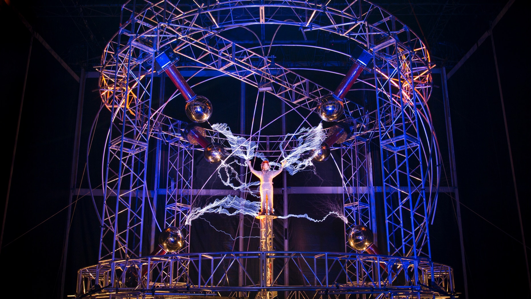 Oct. 5, 2012: Magician David Blaine stands inside an apparatus surrounded by a million volts of electric currents streamed by tesla coils during his 72-hour "Electrified: 1 Million Volts Always On" stunt on Pier 54