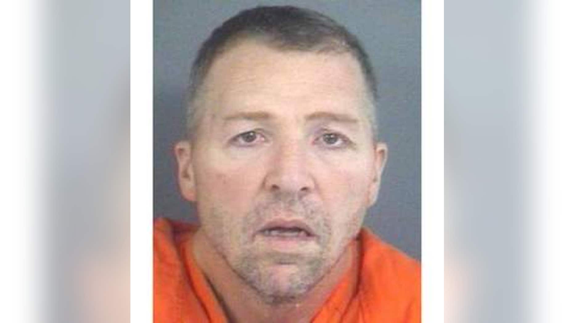 David E. Ison, 46, charged with five counts of murder in Indiana.