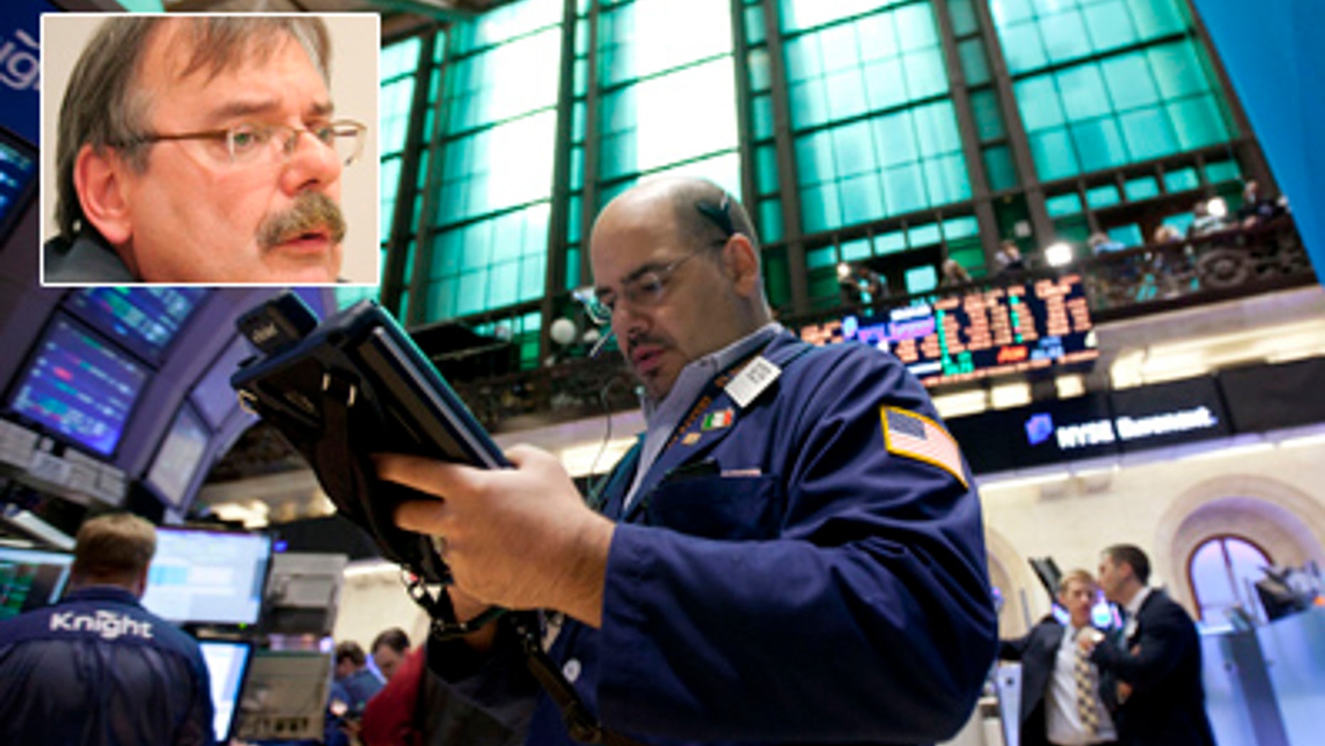 A trader works on the floor of the New York Stock Exchange on Friday, Aug. 5, 2011 in New York. A government report that hiring improved in July sent stocks sharply higher just after the market opened. The rally lasted less than a half-hour. Many economists still fear that the economy might dip back into recession. (AP Photo/Jin Lee)