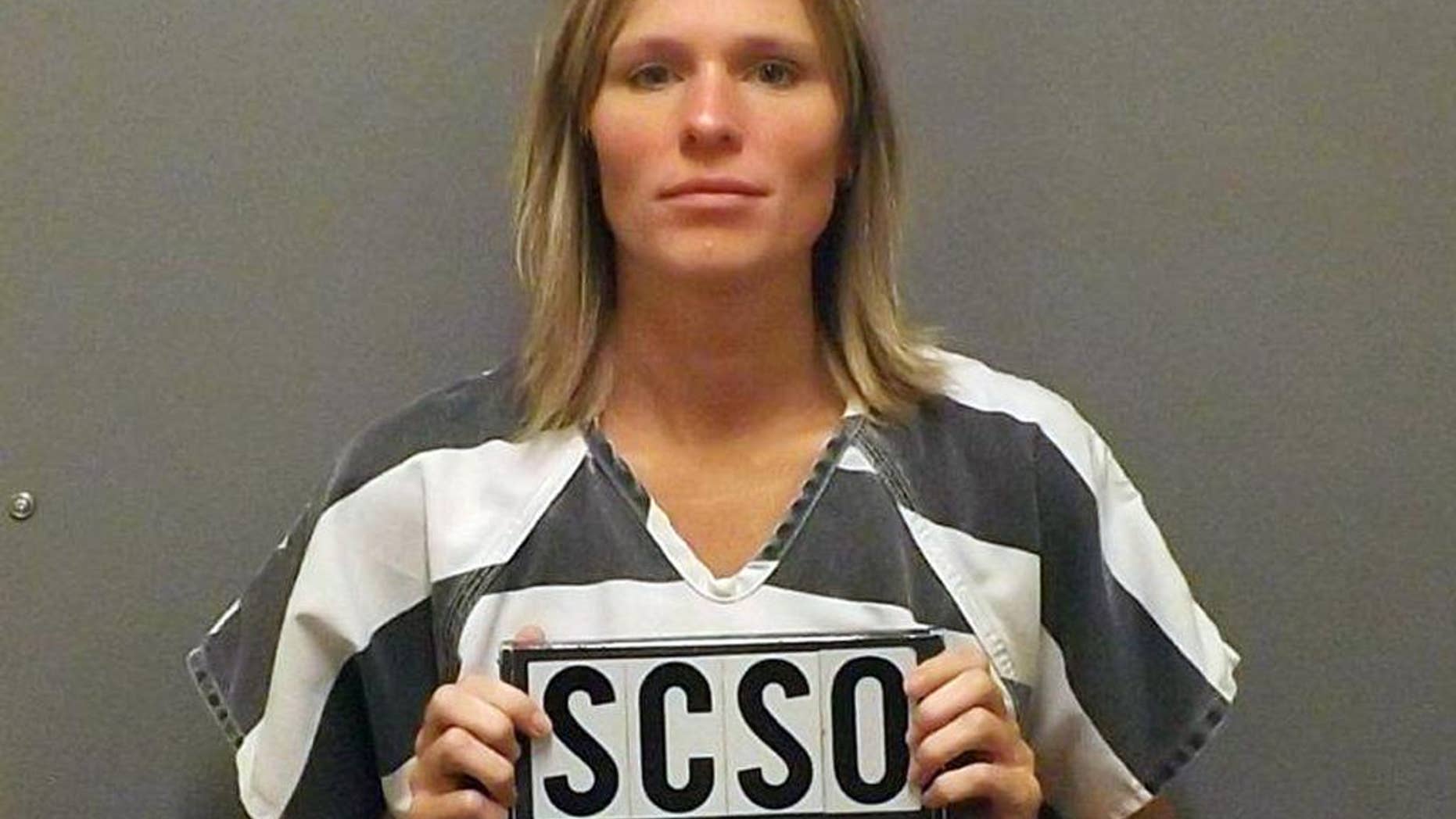 File - In this Oct. 31, 2013 file photo provided by the Sioux County, Iowa, Sheriff’s Office is day care provider Rochelle Sapp of Orange City, Iowa. Sapp is charged with first-degree murder and child endangerment causing death in the October 2013 death of Autumn Elgersma. (AP Photo/Sioux County Sheriff’s Office, File)