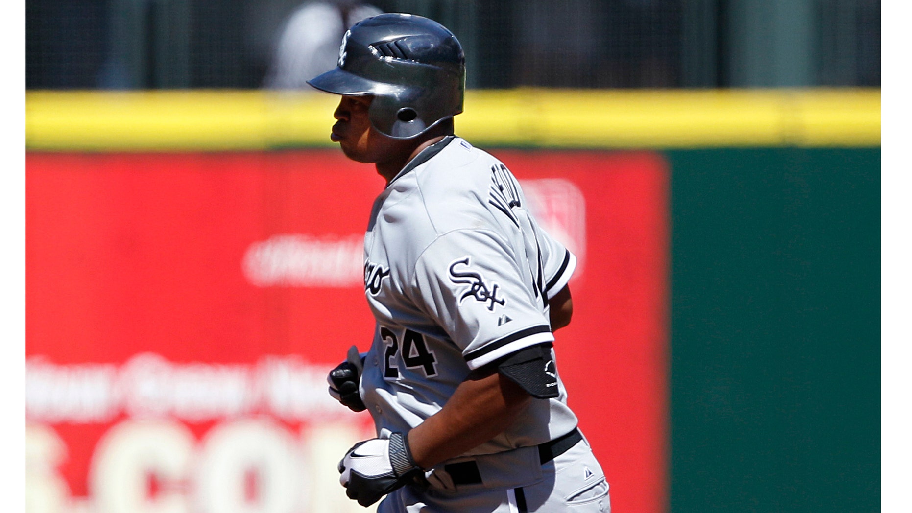 Chicago White Sox Dayan Viciedo rounds the bases on his three-run home run against Seattle Mariners in the fourth inning of a baseball game, Sunday, Aug. 28, 2011, in Seattle. (AP Photo/Elaine Thompson)