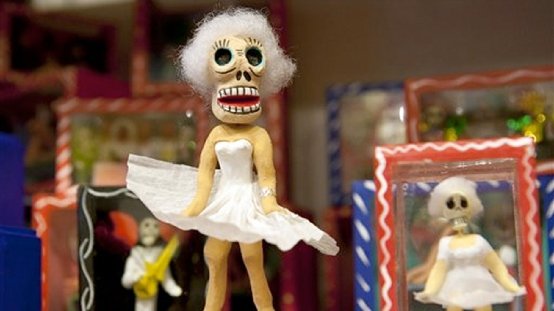 Oct. 3, 2011: A Day of the Dead skeleton figurine designed around a Marilyn Monroe theme stands on a shelf at the store Masks y Mas in Albuquerque, N.M.