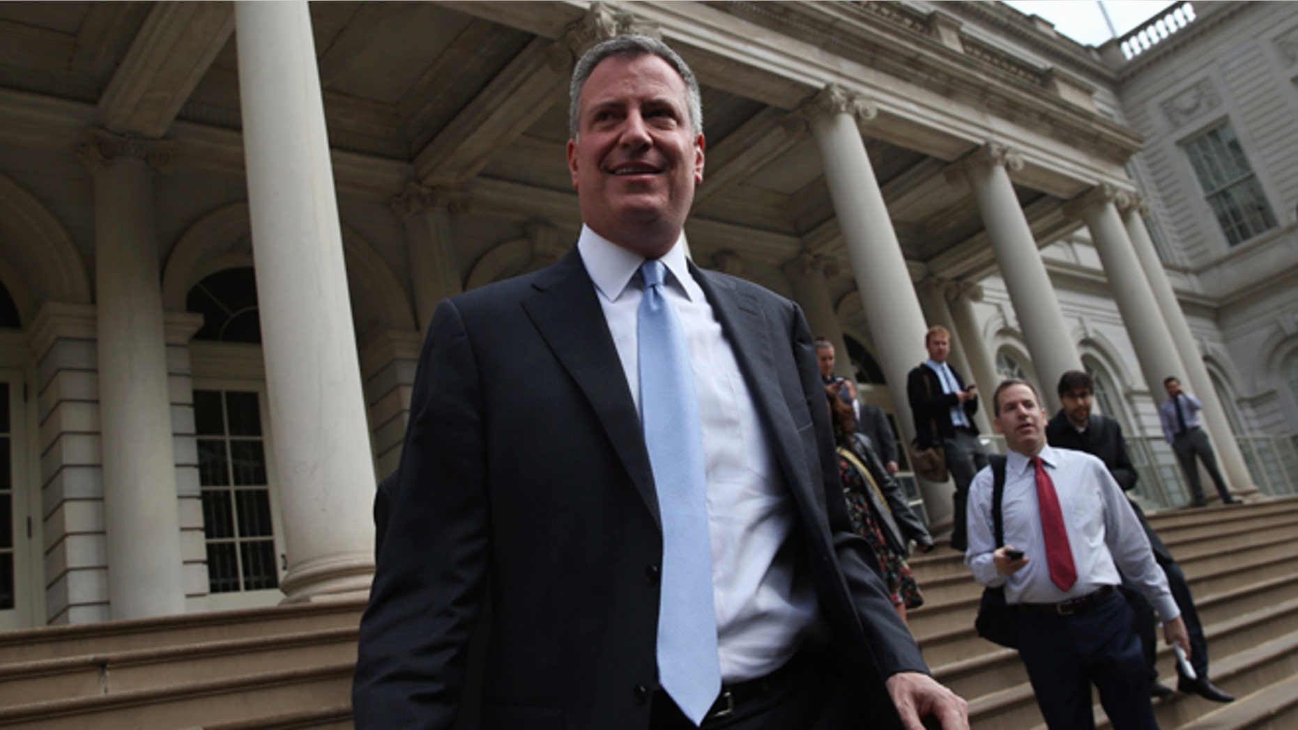 NEW YORK, NY - NOVEMBER 06: New York City Mayor-elect Bill de Blasio leaves City Hall after meeting with outgoing Mayor Michael Bloomberg on November 6, 2013 in New York City. It was the first meeting between the two since de Blasio's election victory the day before. (Photo by John Moore/Getty Images)