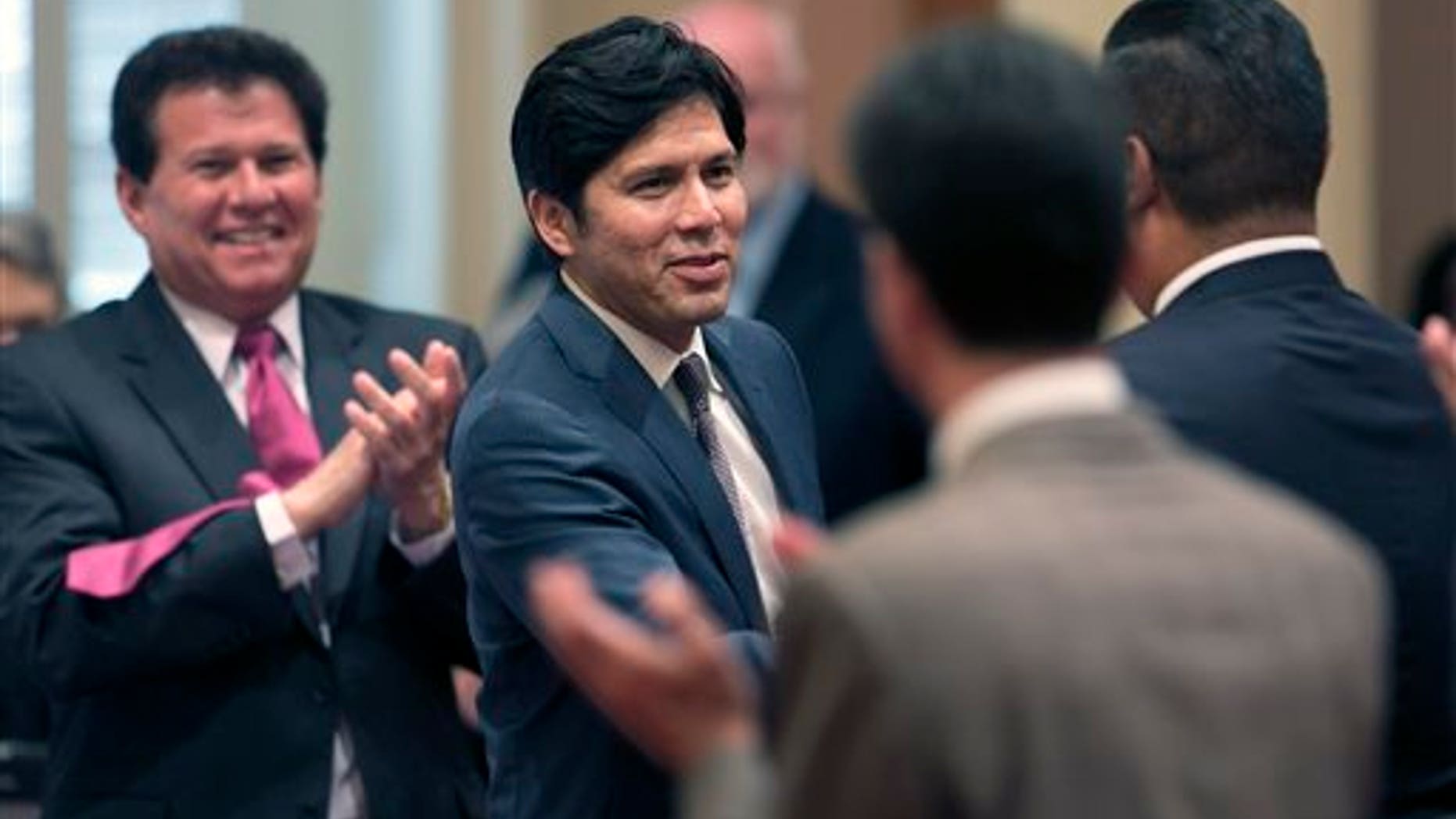 California Senate leader Kevin de Leon shaking hands with lawmakers in 2014.