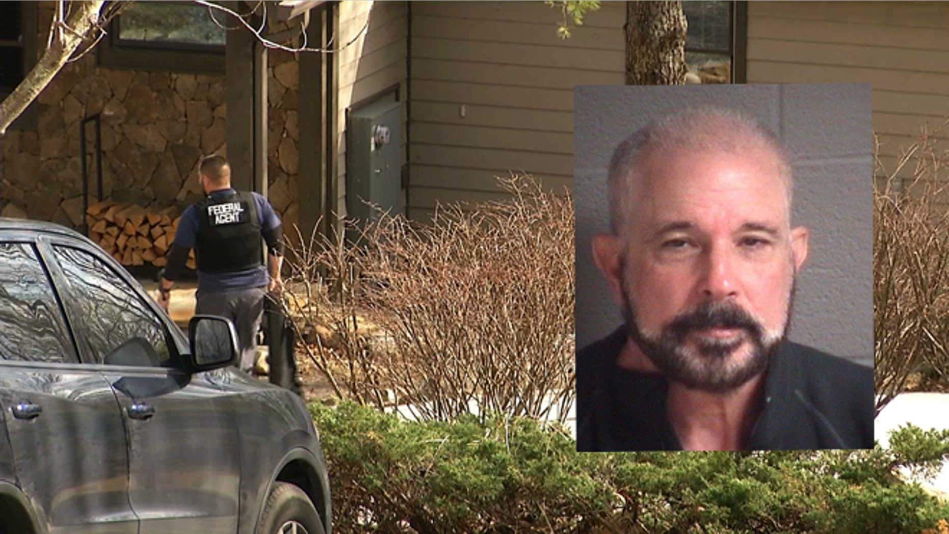 In this image taken from video, federal agents execute a search warrant at the Sapphire, N.C., home of Jose Lantigua on Monday, March 23, 2015. Lantigua, a Jacksonville businessman reported dead two years ago in Venezuela, was arrested in North Carolina on Saturday, March 21, on alleged fraud charges after his life insurance companies filed a lawsuit alleging he was alive and they shouldn't be making payments. (AP Photo/Alex Sanz)