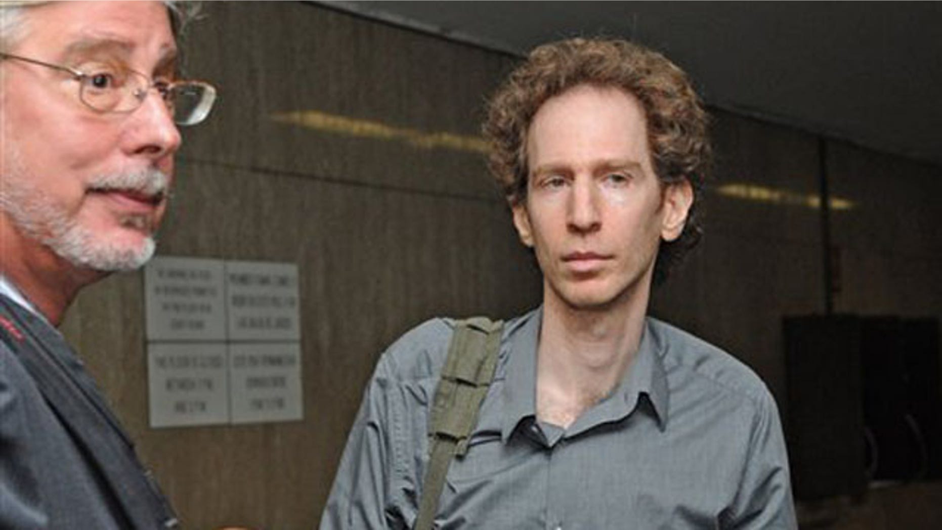 In this Sept. 27, 2010 file photo, attorney Raphael Golb, right, is seen outside the courtroom with his attorney Ron Kuby during a recess in his trial at Manhattan State Supreme court in New York. Golb, who was convicted in September of using online aliases to influence scholarly debate over the Dead Sea Scrolls, is set to be sentenced Thursday, Nov. 18 on identity theft and other charges. (AP Photo/Louis Lanzano, File)