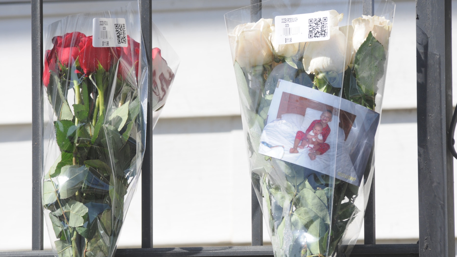 March 27, 2012: Flowers hang on the railing of 117 East Coal Street in Shenandoah, Pa., after fire consumed the home early Tuesday morning claiming four lives.