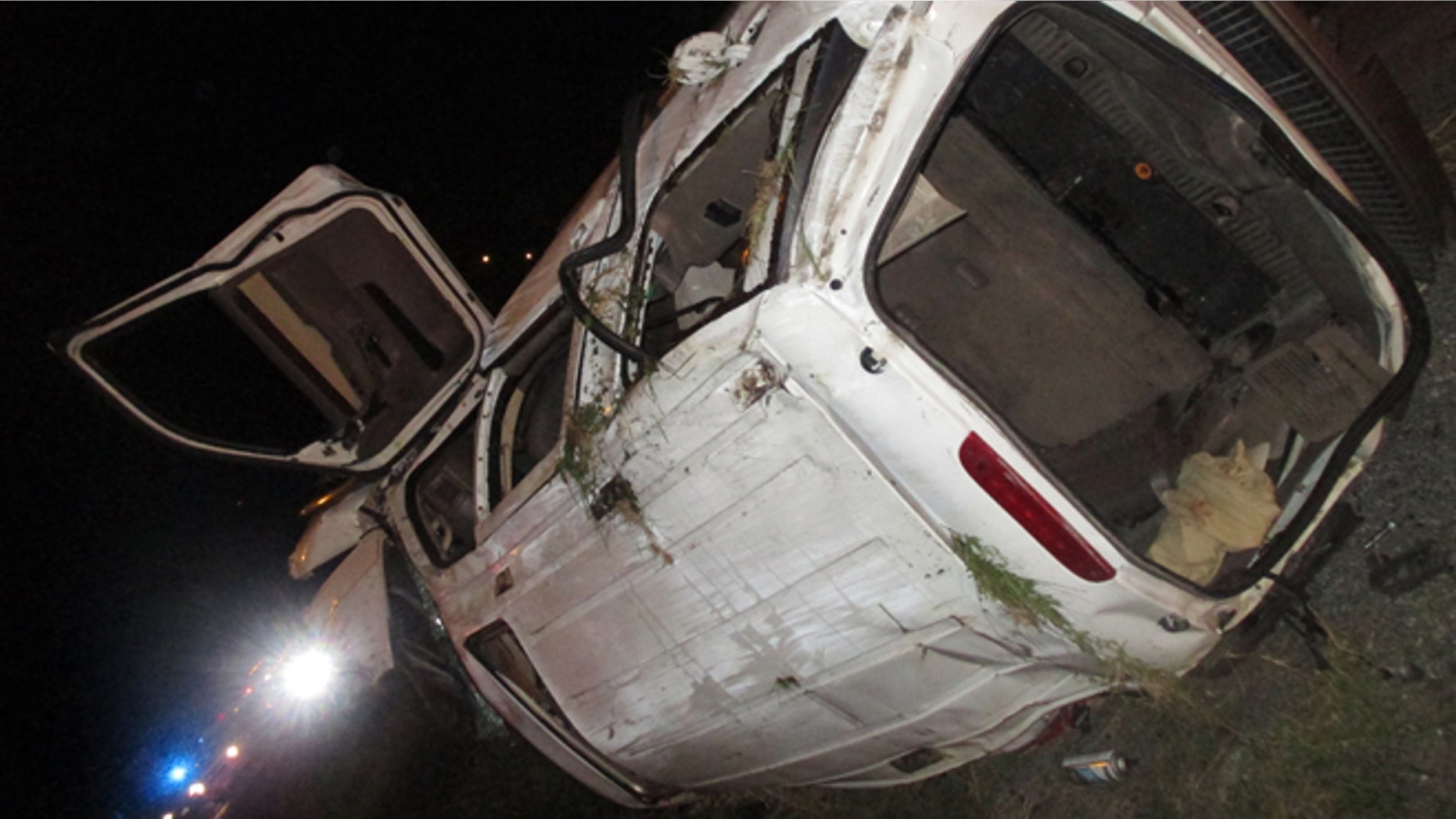 In this photo provided by the Edna Police Department, an SUV that flipped several times remains on the scene following a fatal crash and police chase Thursday, Sept. 24, 2015, in Edna, Texas. Officers tried to stop the SUV for a traffic violation but the vehicle sped away and police gave chase. (Edna Police Department via AP) MANDATORY CREDIT