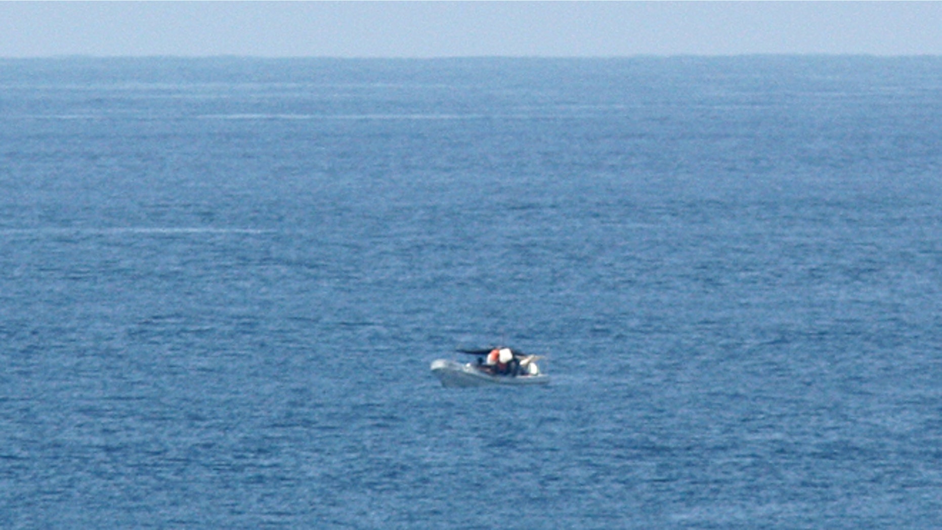 March 10, 2012: A passenger of the American-based cruise ship Star Princess, shows a fishing vessel adrift in the Pacific Ocean off the Galapagos Islands.