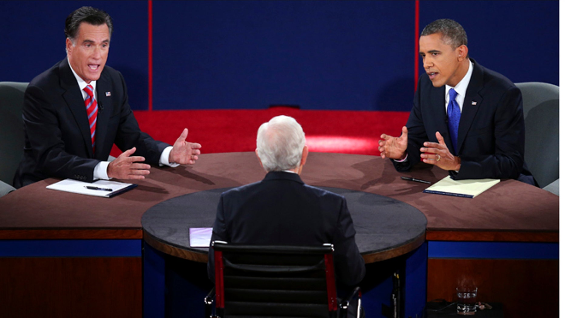 Oct. 22, 2012: Republican presidential nominee Mitt Romney and President Barack Obama answer a question during the third presidential debate at Lynn University, in Boca Raton, Fla.