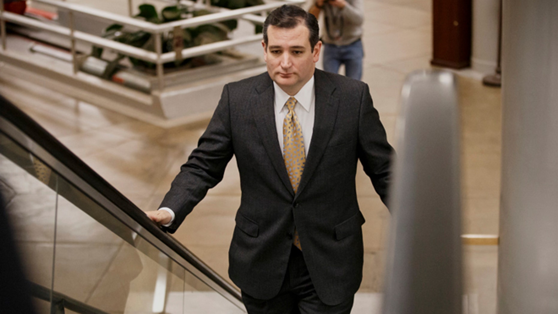 Sen. Ted Cruz, R-Texas arrives on Capitol Hill in Washington, Wednesday, Feb. 12, 2014, as senators go to the chamber for a vote to extend the Treasury's borrowing authority. Setting the vote in motion was one of Senate Republican leader Mitch McConnells Republican colleagues, Cruz, the tea party darling who has caused heartburn for his GOP colleagues in his year in the Senate. Cruz insisted on a 60-vote threshold for the Senate to proceed to legislation to allow the government to borrow money to pay its bills. (AP Photo/J. Scott Applewhite)