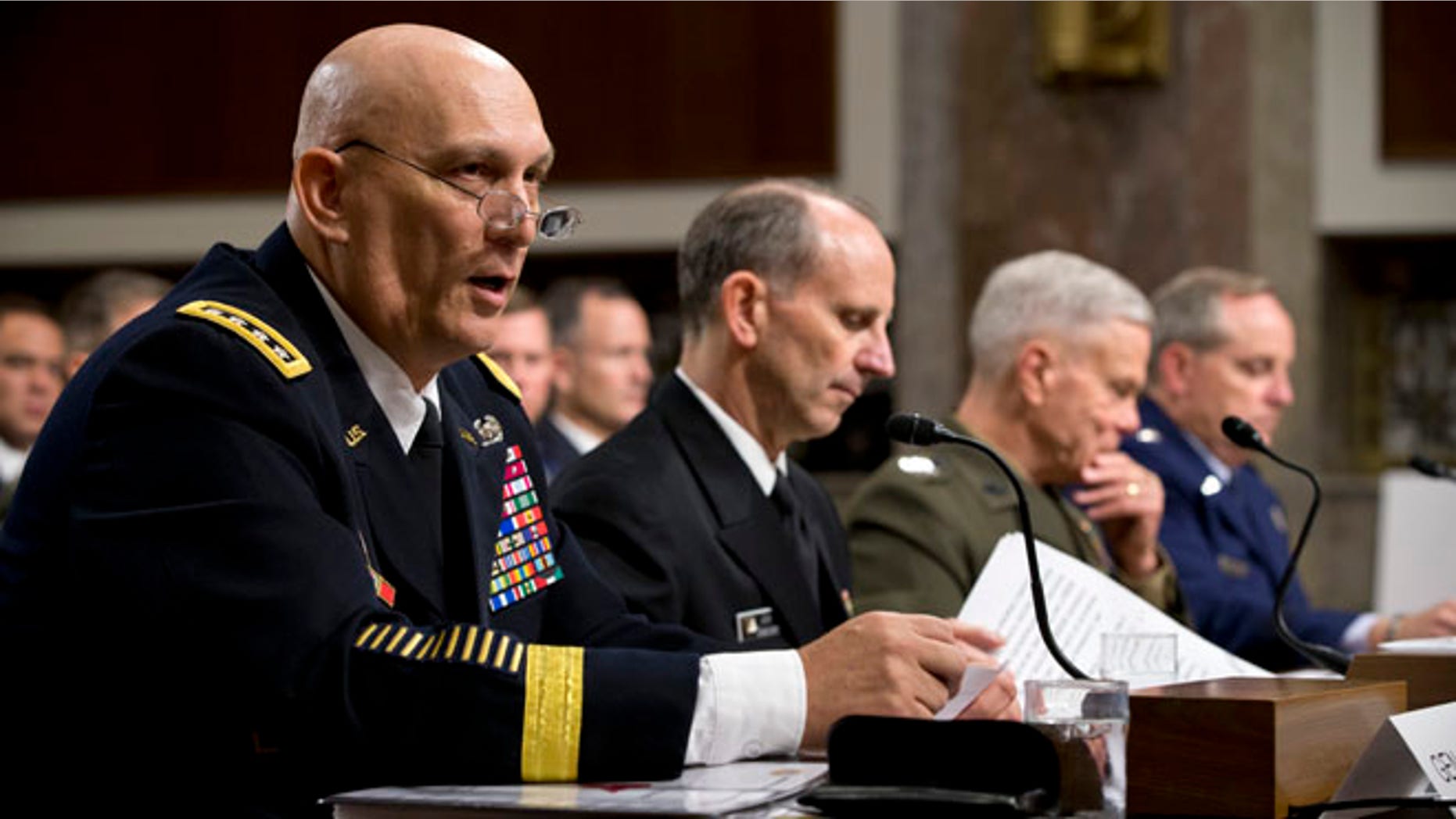 Army Chief of Staff Gen. Raymond Odierno, Chief of Naval Operations Adm. Jonathan Greenert, Marine Corps Commandant Gen. James Amos, and Air Force Chief of Staff Gen. Mark Welsh, testify on Capitol Hill in Washington, Thursday, Nov. 7, 2013, before the Senate Armed Services Committee on budget cuts to the military.