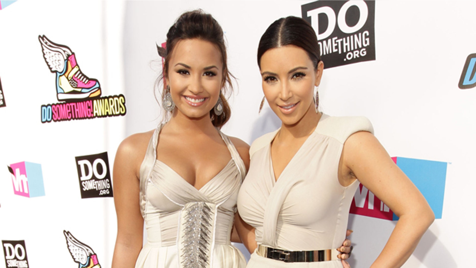 Demi Lovato and Kim Kardashian arrive at the 2011 VH1 Do Something Awards at the Hollywood Palladium in Hollywood, California.