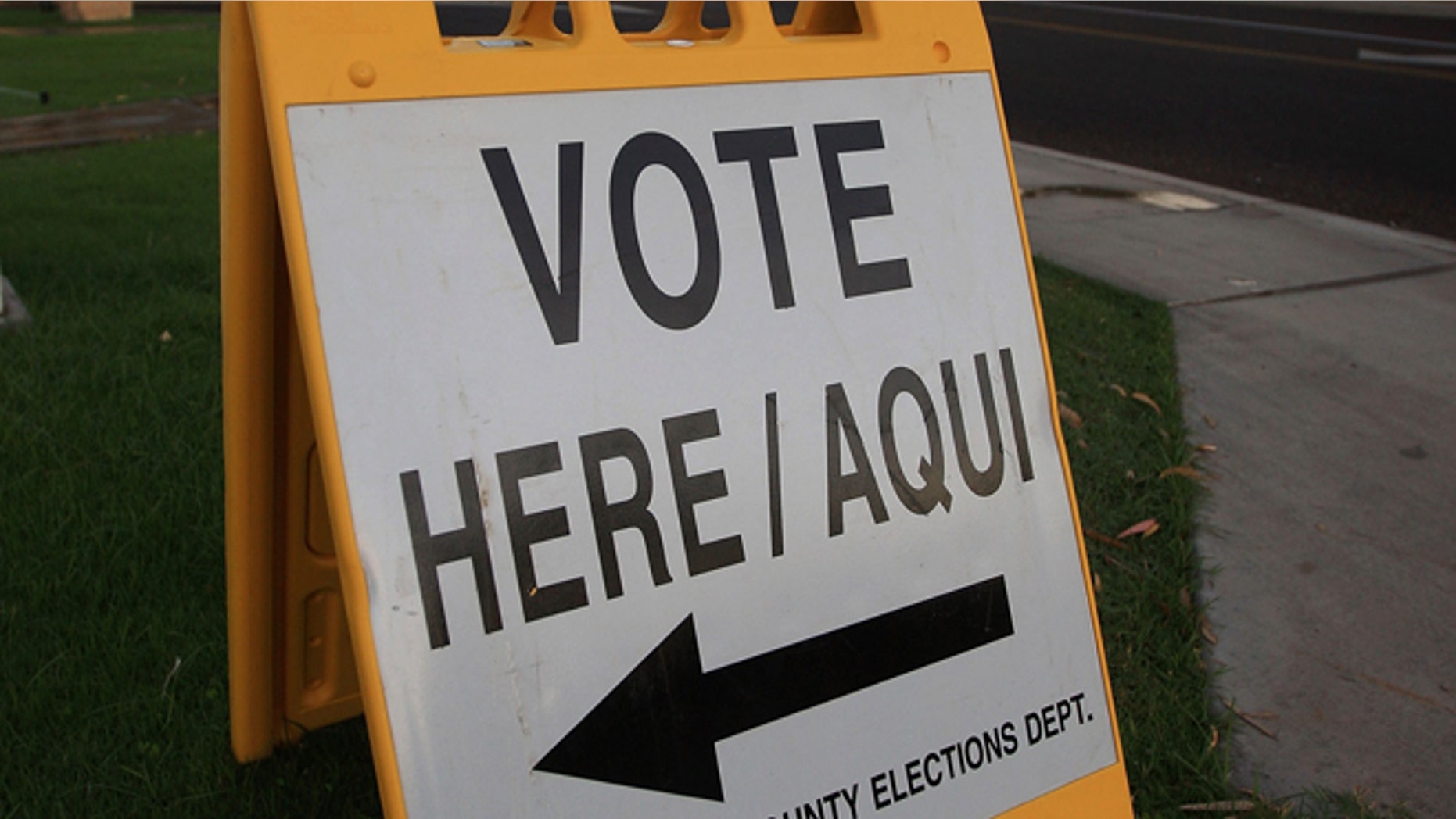 PHOENIX - NOVEMBER 4: A bilingual sign announces a polling place in the home state of Republican presidential nominee U.S. Sen. John McCain (R-AZ) November 4, 2008 in Phoenix, Arizona. Voting is underway in the U.S. presidential elections with Democratic presidential nominee Sen. Barack Obama (D-IL) leading in the polls against the Republican presidential nominee Sen. John McCain (R-AZ). (Photo by David McNew/Getty Images)