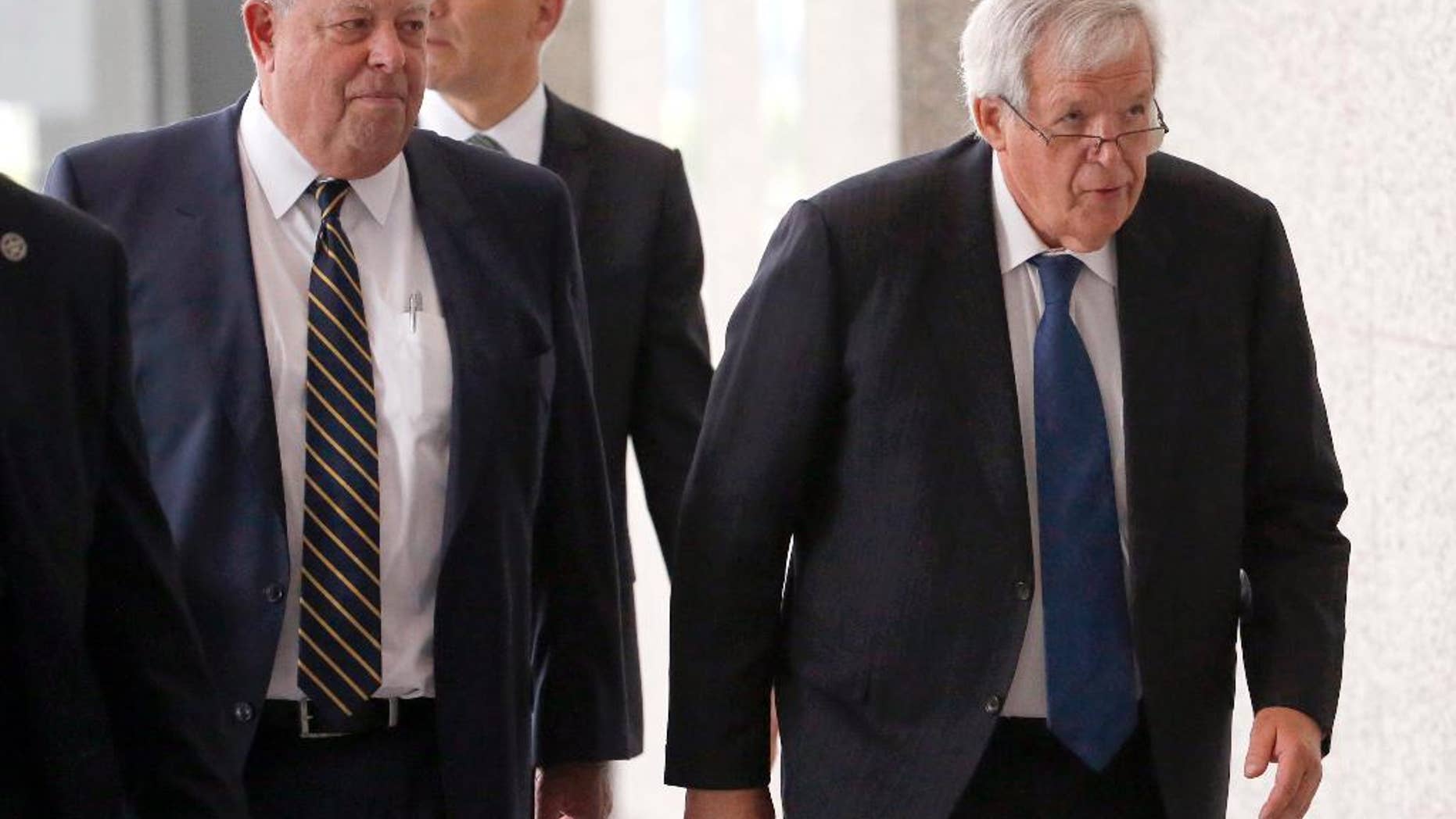 FILE - In this June 9, 2015, file photo, former House Speaker Dennis Hastert, right, departs the federal courthouse with his attorney Thomas C. Green in Chicago, after his arraignment on federal charges that he broke federal banking laws and lied about the money when questioned by the FBI. Attorneys are expected to return to federal court Thursday, June 18 2015, to set a schedule for how Hastert’s case will proceed. The indictment alleges Hastert agreed to pay $3.5 million to someone from his days as a high school teacher not to reveal a secret about past misconduct. (AP Photo/Charles Rex Arbogast, File)