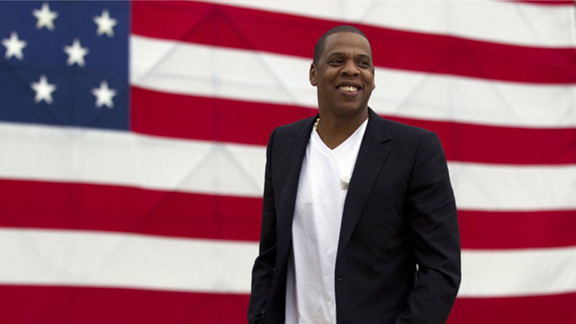 FILE- In this May 14, 2012 file photo, entertainer Shawn "Jay-Z" Carter arrives at the Philadelphia Museum of Art. The rap mogul is taking some heat over his relationship with the luxury store Barneys New York, amid allegations the store racially profiled two customers. Jay-Z plans to partner with the store for an upcoming holiday collection of items. (AP Photo/Matt Rourke, File)