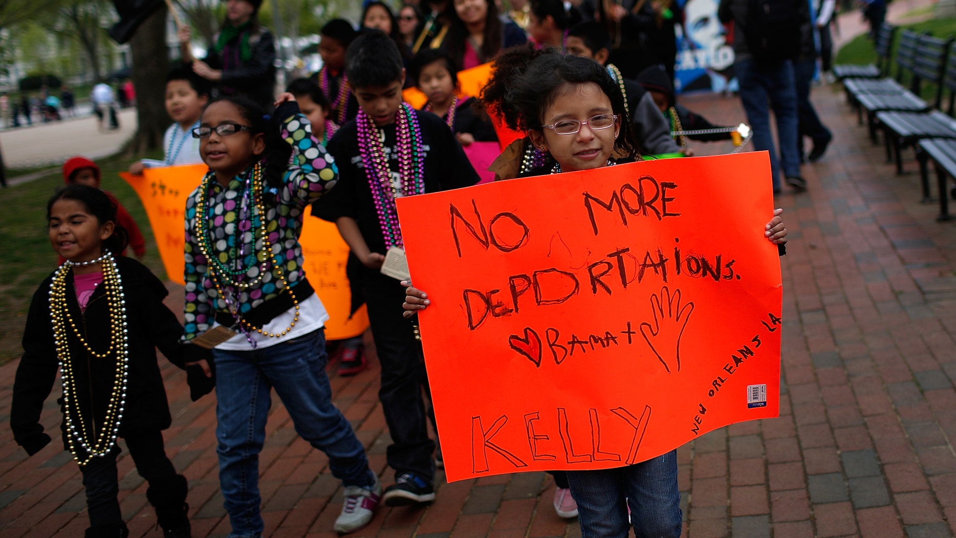 WASHINGTON, DC - APRIL 23: Children of immigrants march near the White House while calling for immigration reform April 23, 2014 in Washington, DC. About 100 people joined the protest to voice their concerns over the deportation policies of the U.S. government. (Photo by Win McNamee/Getty Images)