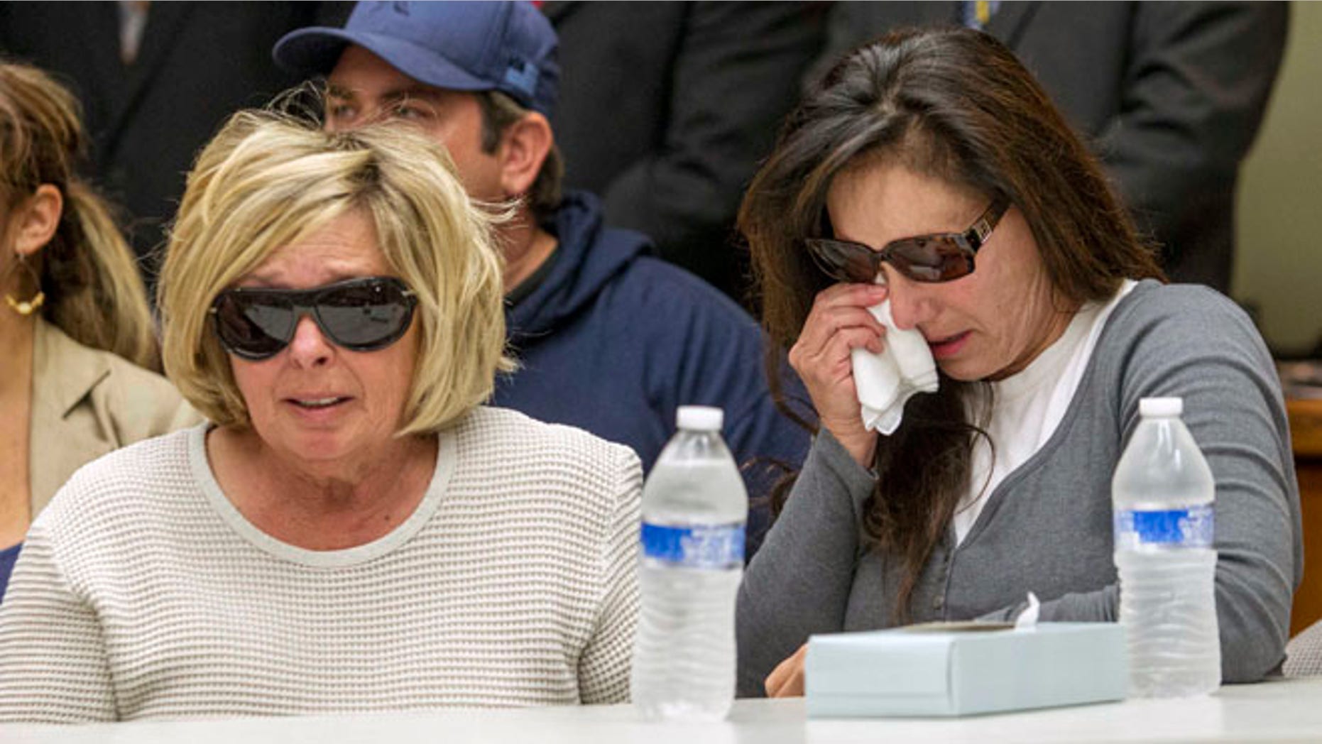 Nov. 15, 2013: Susan McStay, mother of Joseph McStay, left, and friend of victims' family, Emily, whose last name was not given, listen during a news conference at the San Bernardino County Sheriffs Department Headquarters.