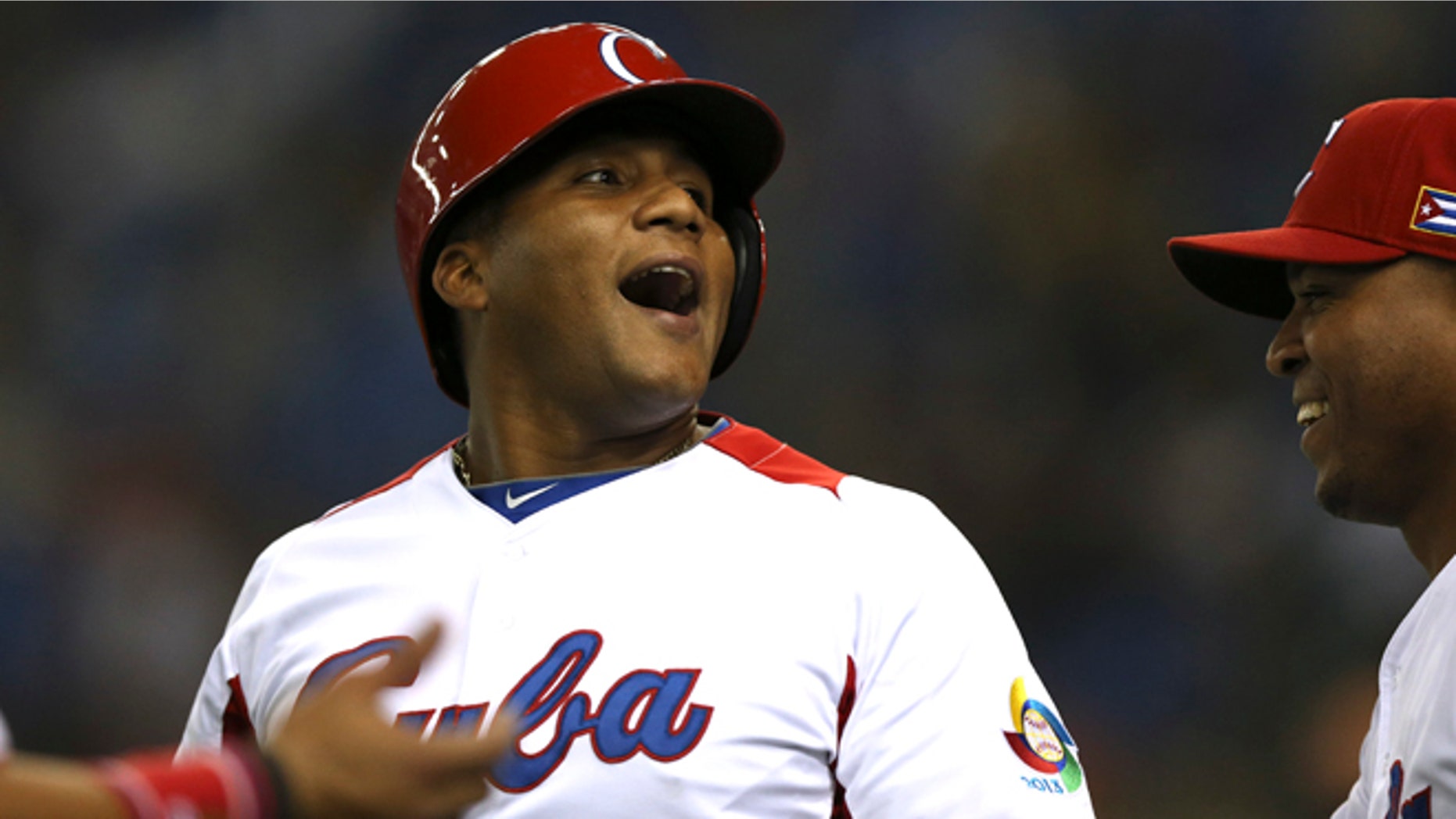 Archive photo from March 9, 2013, of outfielder Alfredo Despaigne after hitting a home run against Taiwan for the Cuban national baseball team at the World Baseball Classic. (AP/Toru Takahashi)