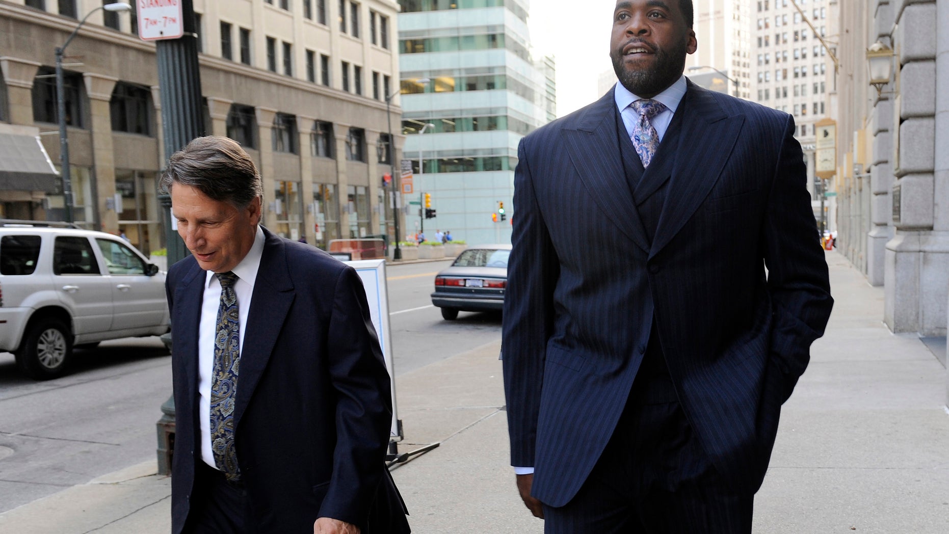 Sept. 6, 2012 - FILE photo of former Detroit Mayor Kwame Kilpatrick walking to federal court in Detroit with attorney Jim Thomas.
