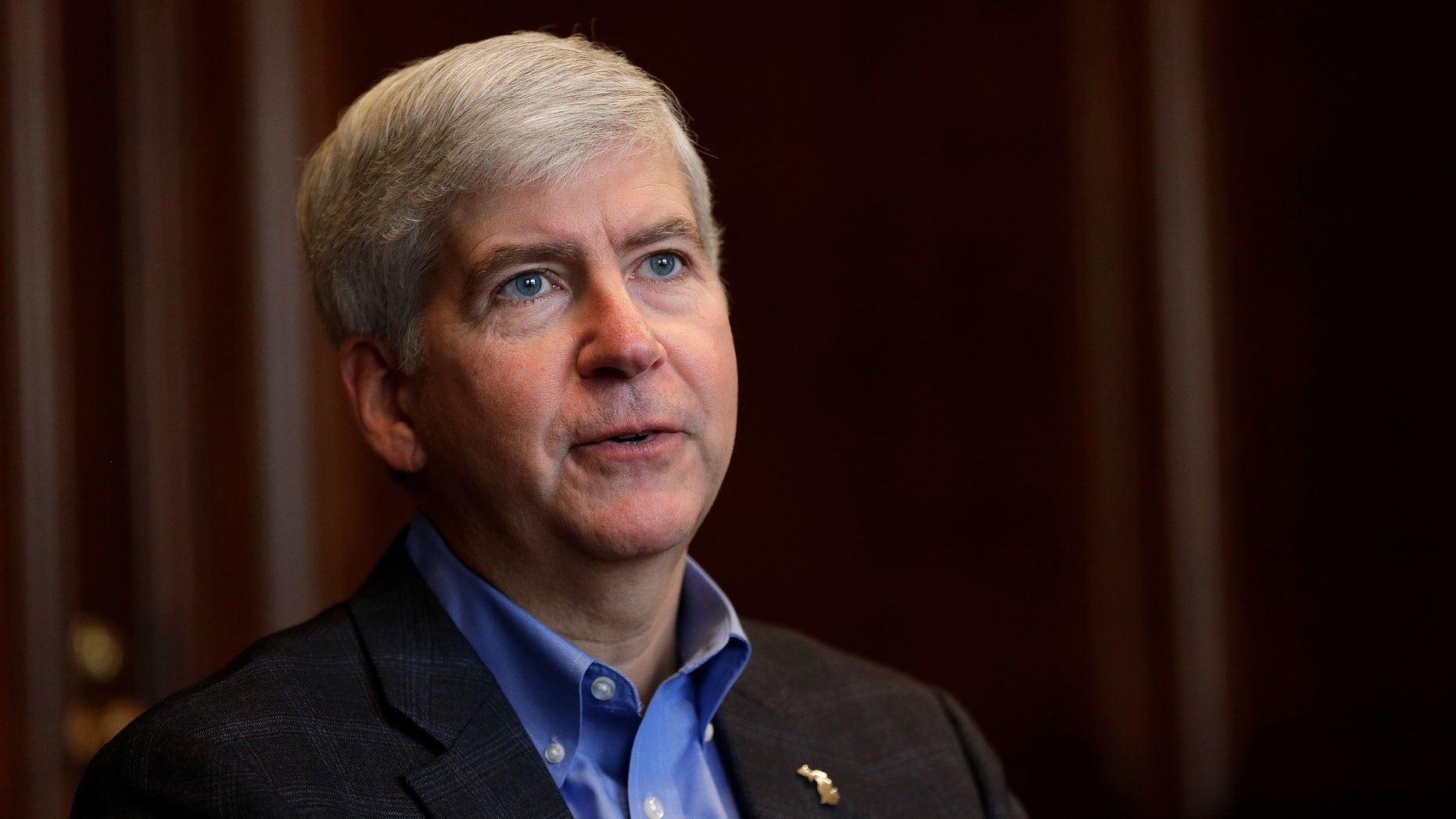 Gov. Rick Snyder tells the Associated Press he will declare a financial emergency prior his television broadcast in Detroit, Friday, March 1, 2013. Snyder declared a financial emergency in Detroit on Friday, pushing the city closer to having a state-appointed emergency manager control its finances. (AP Photo/Paul Sancya)