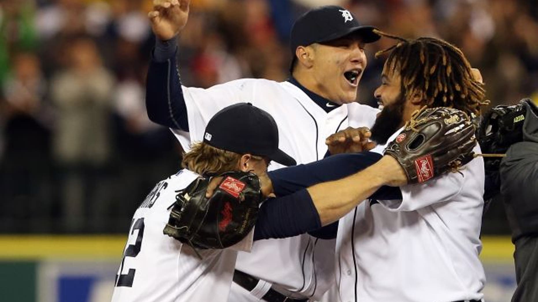 DETROIT, MI - OCTOBER 18: (L-R) Andy Dirks #12, Avisail Garcia #34 and Prince Fielder #28 of the Detroit Tigers celebrate after they won 8-1 against the New York Yankees during game four of the American League Championship Series at Comerica Park on October 18, 2012 in Detroit, Michigan. (Photo by Leon Halip/Getty Images)