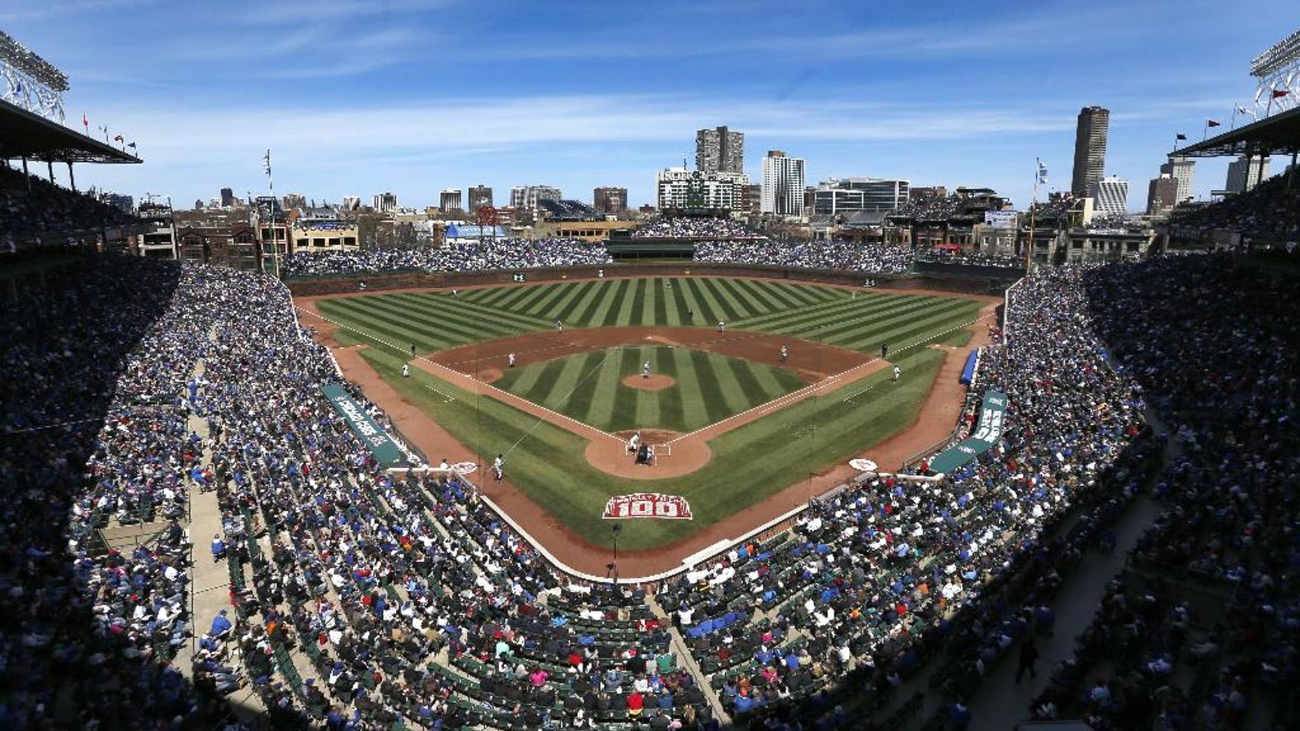 The Arizona Diamondbacks and Chicago Cubs begin a baseball game Wednesday, April 23, 2014, in Chicago. Wednesday was the 100th anniversary of the first game at the ballpark, between the Chicago Federals and the Kansas City Packers. (AP Photo/Charles Rex Arbogast)